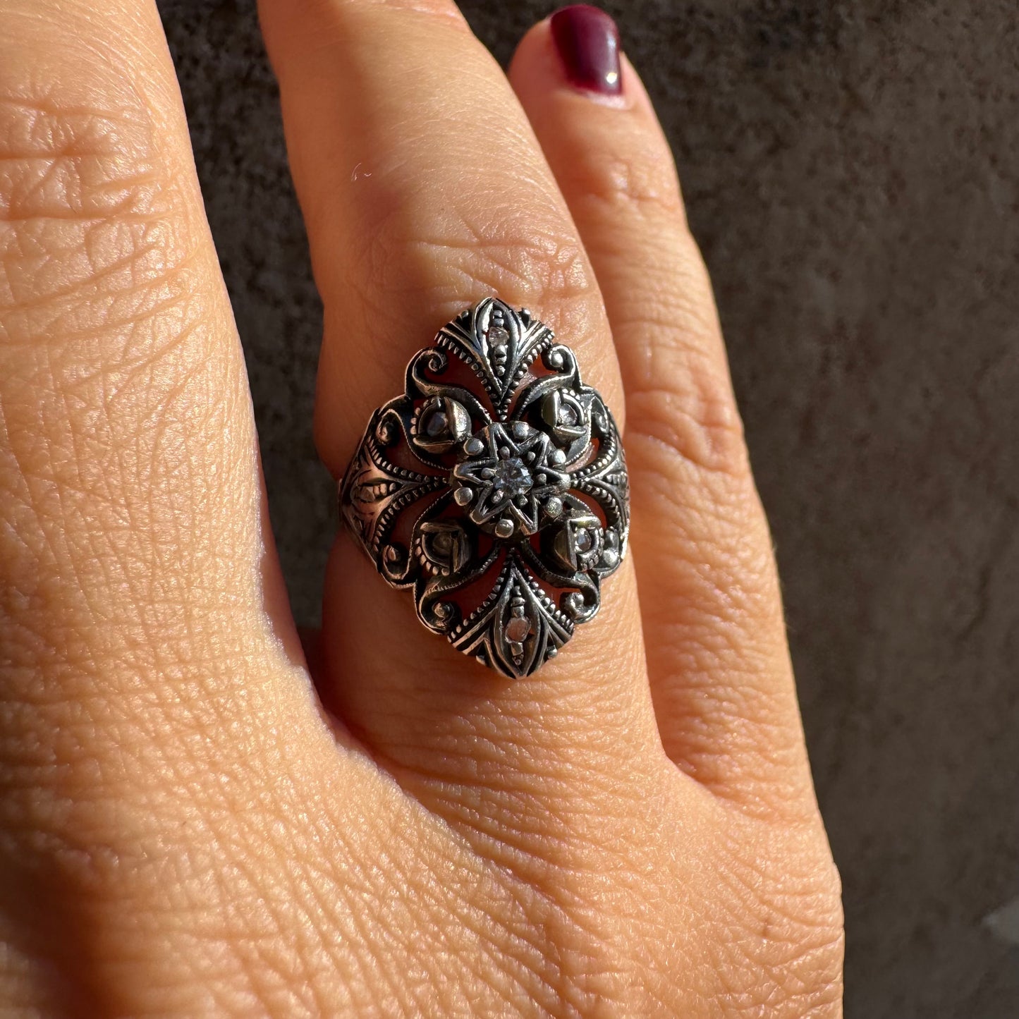 18K gold & silver ring with an intricate floral and leaf filigree design set with Diamonds