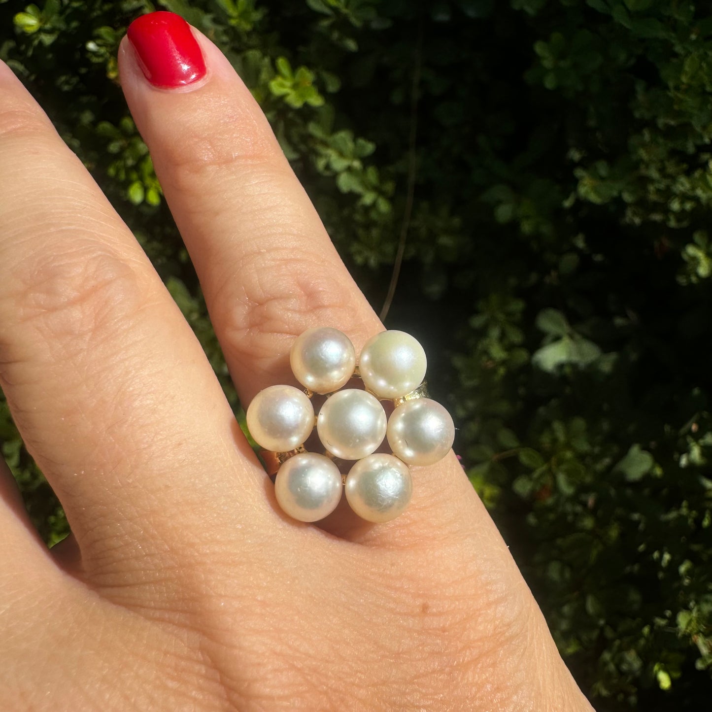 14K gold ring set with seven round Pearls in a bold floral cluster