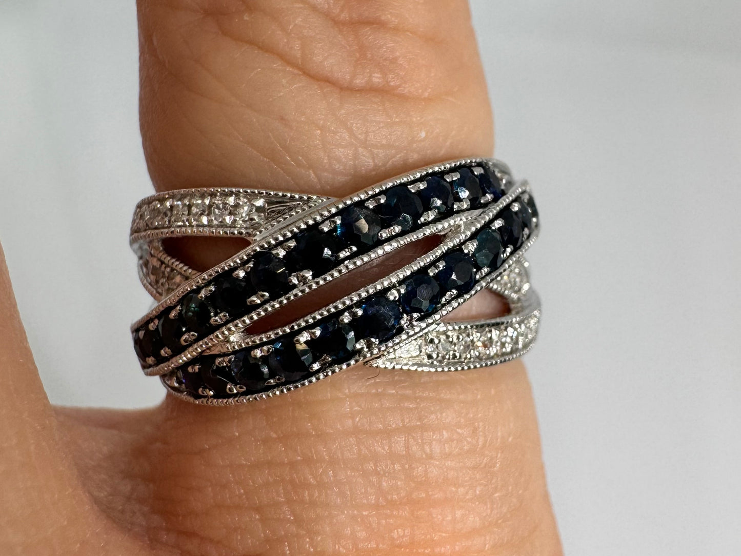 14K gold crossover ring set with Sapphires and sparkling Diamonds