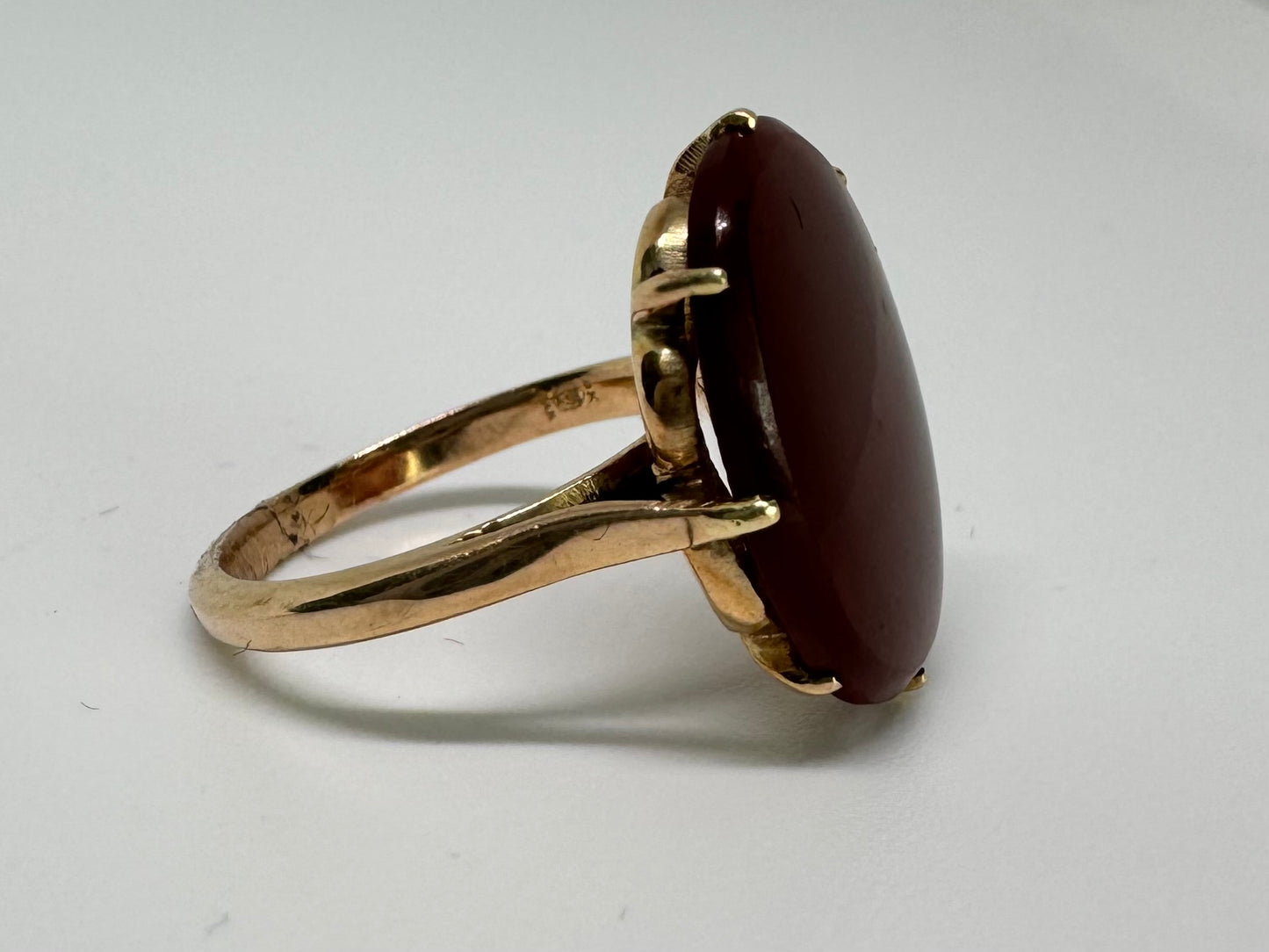 14K gold ring set with a glowing oval Carnelian