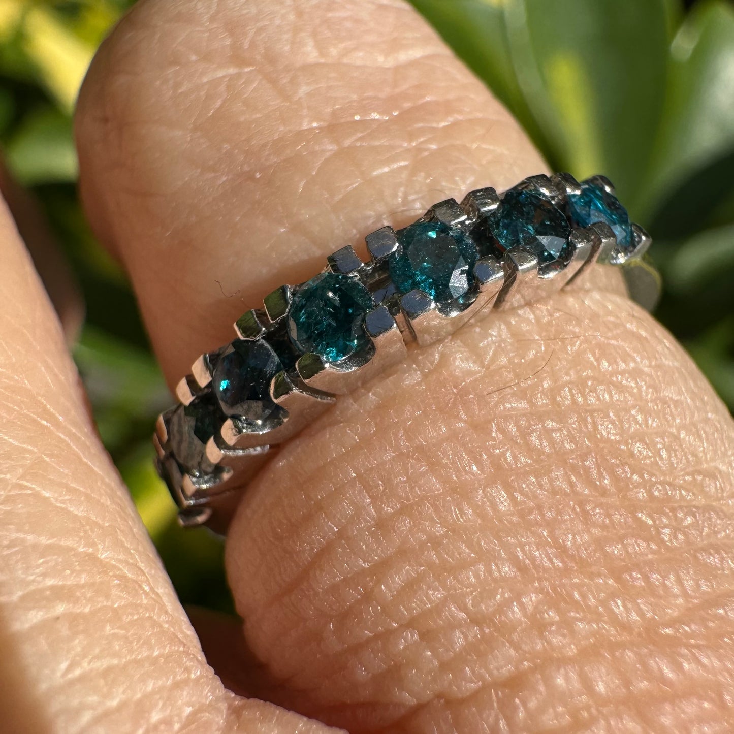 14K gold ring set with blue Diamonds