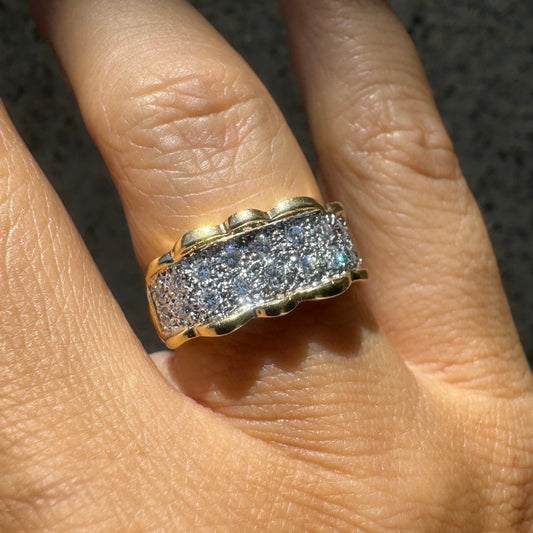 14K gold ring set with center pavé of sparkling Diamonds framed with softly waved gold edges