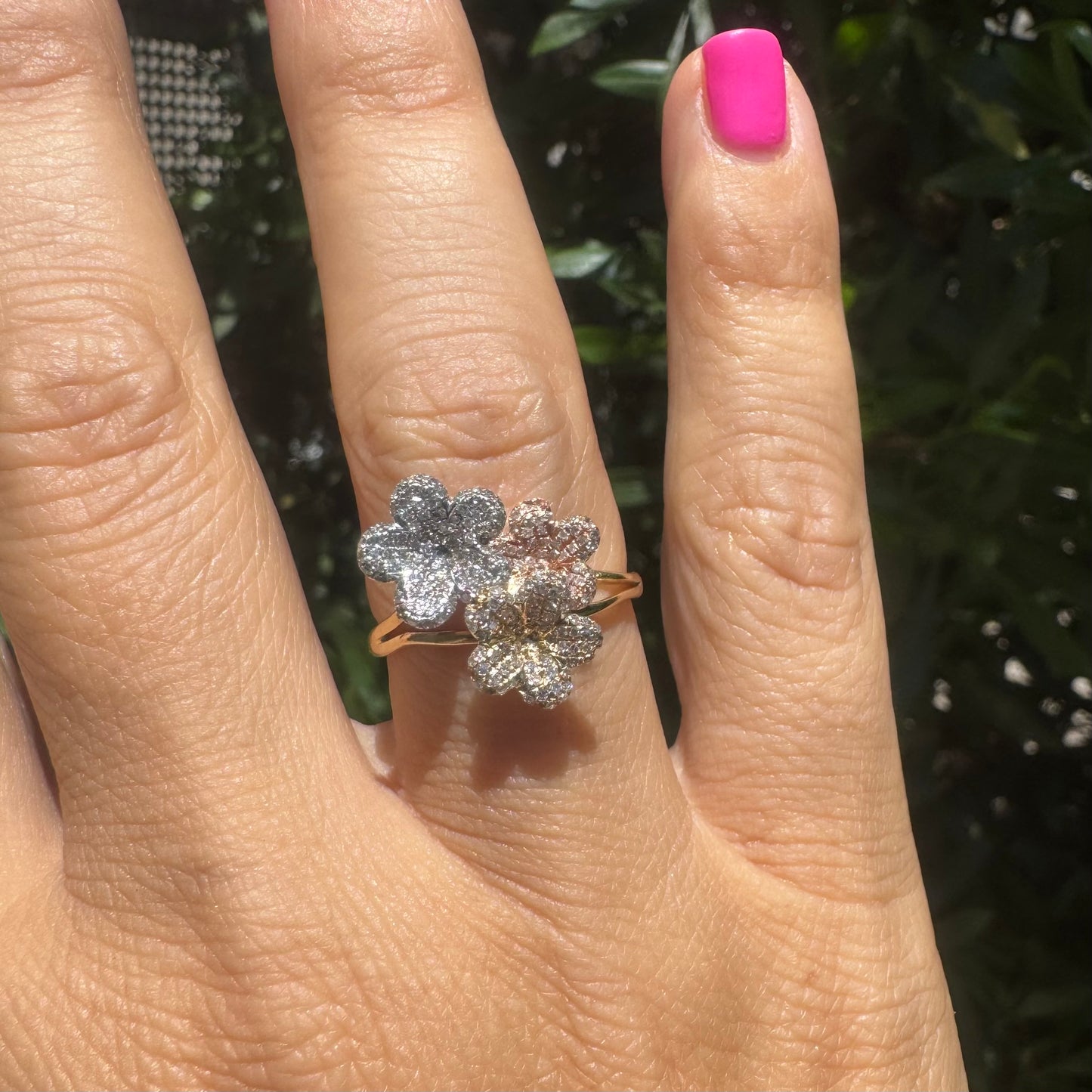 14K gold trio ring featuring white, yellow & rose gold blossoms, each encrusted with sparkling Diamonds.