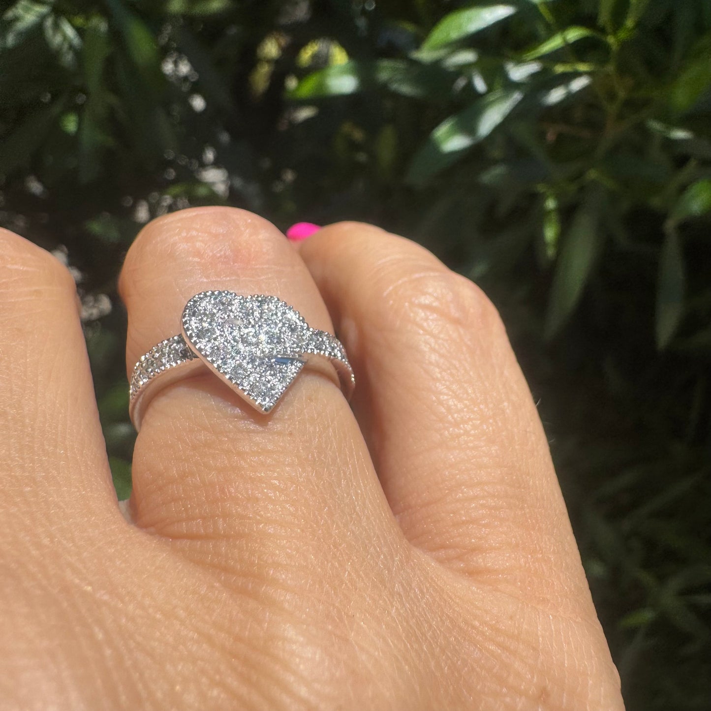 14K gold heart-shaped ring encrusted with shimmering Diamonds