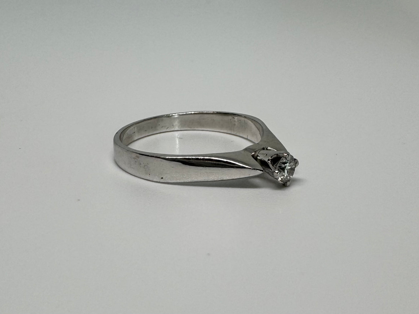 14K gold ring set with one center Diamond