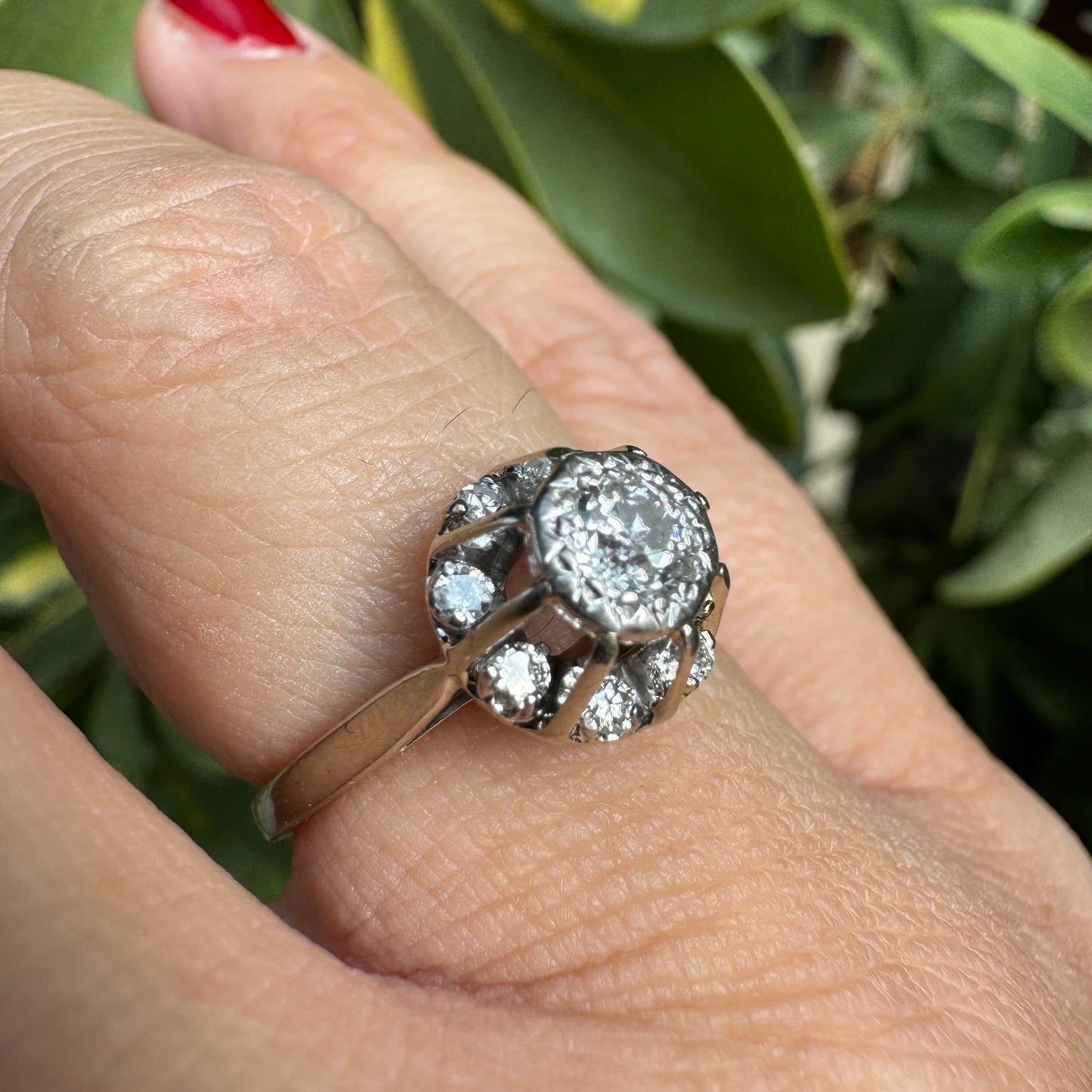 18K gold ring set with Diamonds in     a classic cluster-style