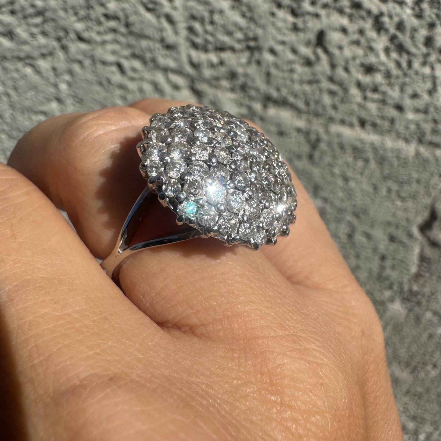 18K gold ring set with Diamonds in a bold pavé setting.