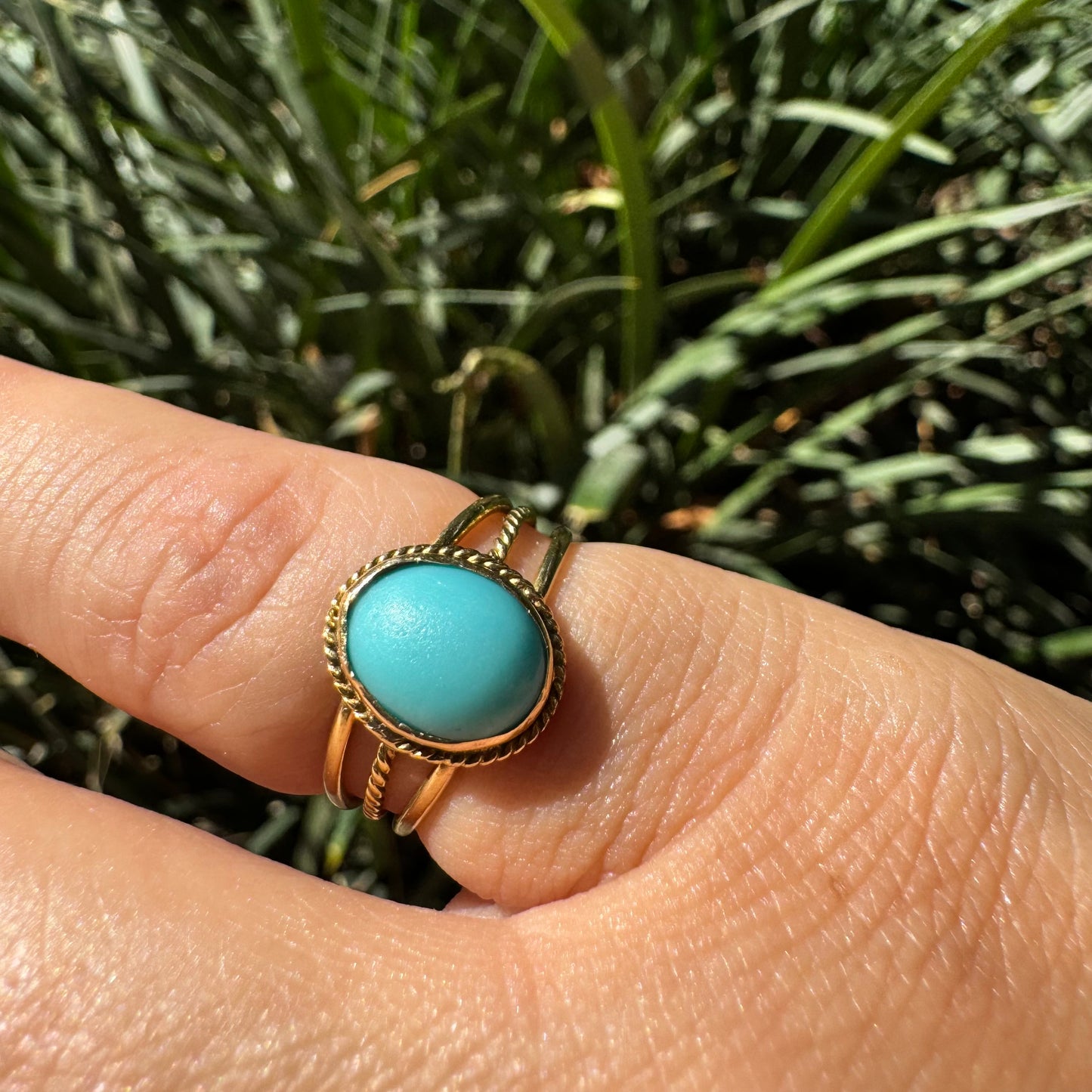 14K gold ring set with an oval Turquoise stone in a delicate rope-style bezel