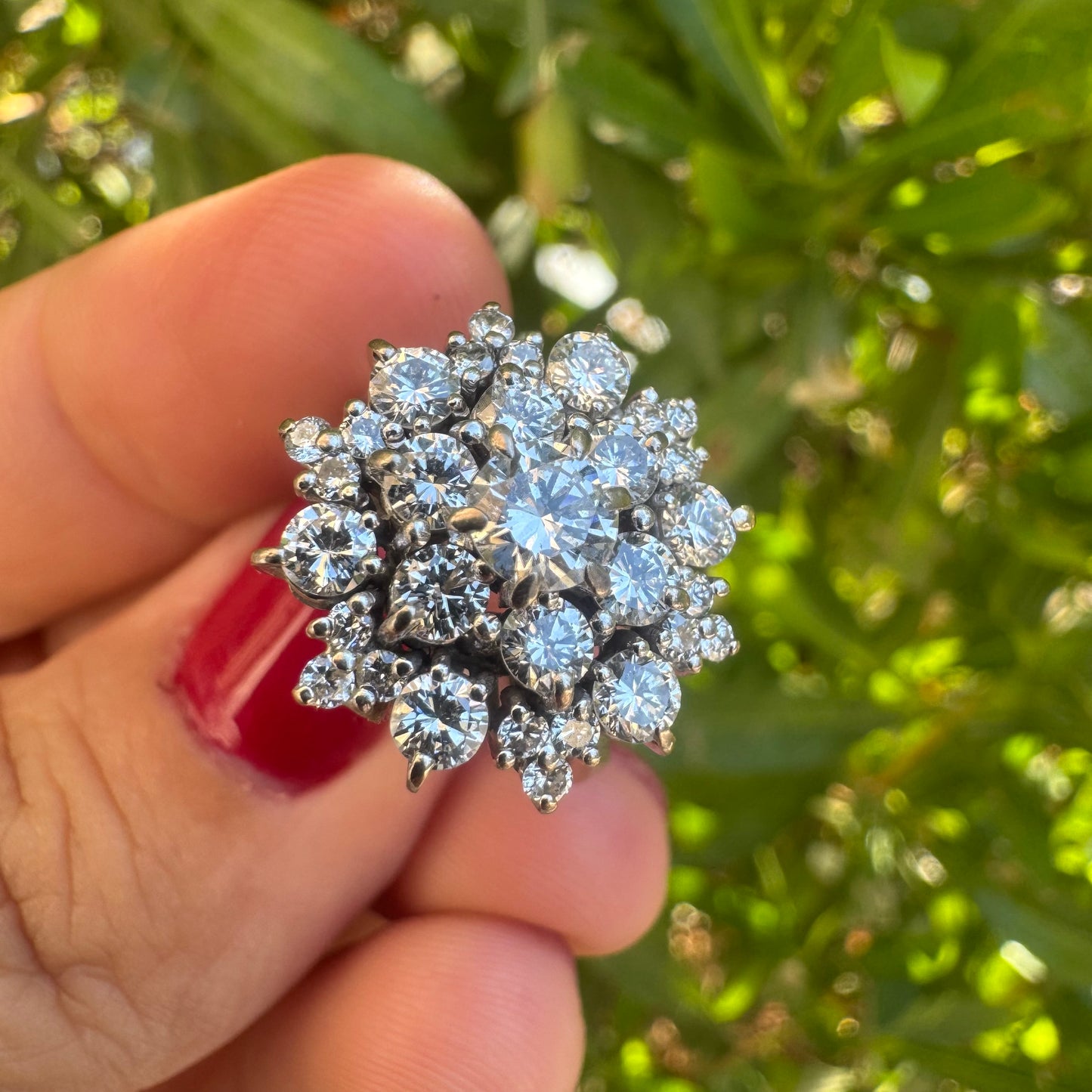 18K gold ring set with sparkling white Diamonds arranged in a floral cluster design