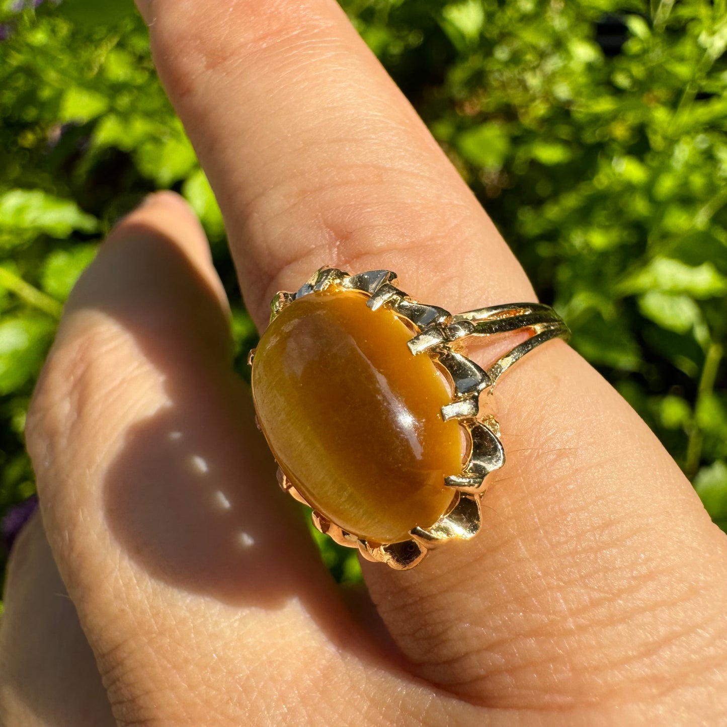 14K gold ring set with a yellow Tiger’s Eye cabochon