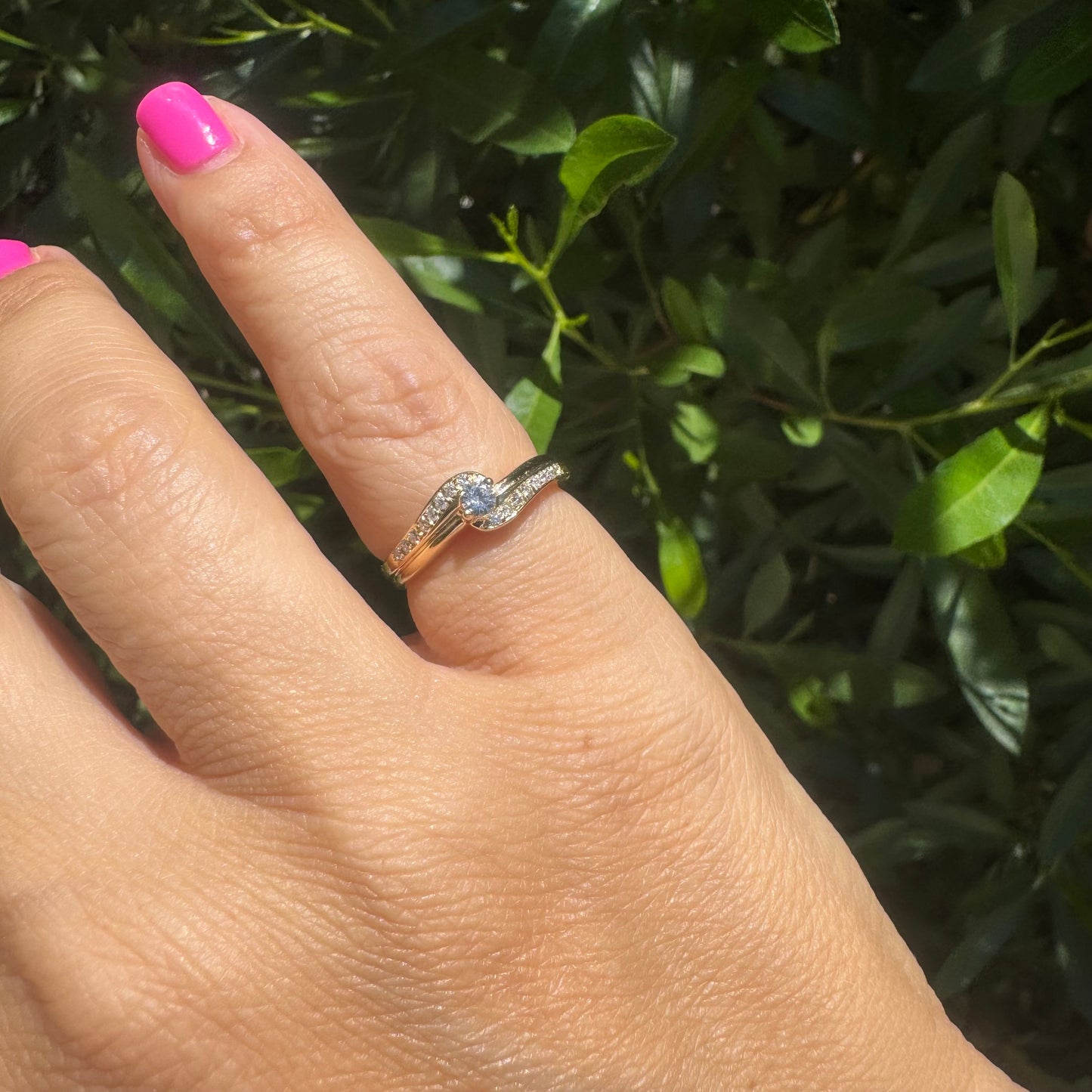 14K gold ring featuring a classic solitaire Diamond at its center, embraced by a pavé-set band