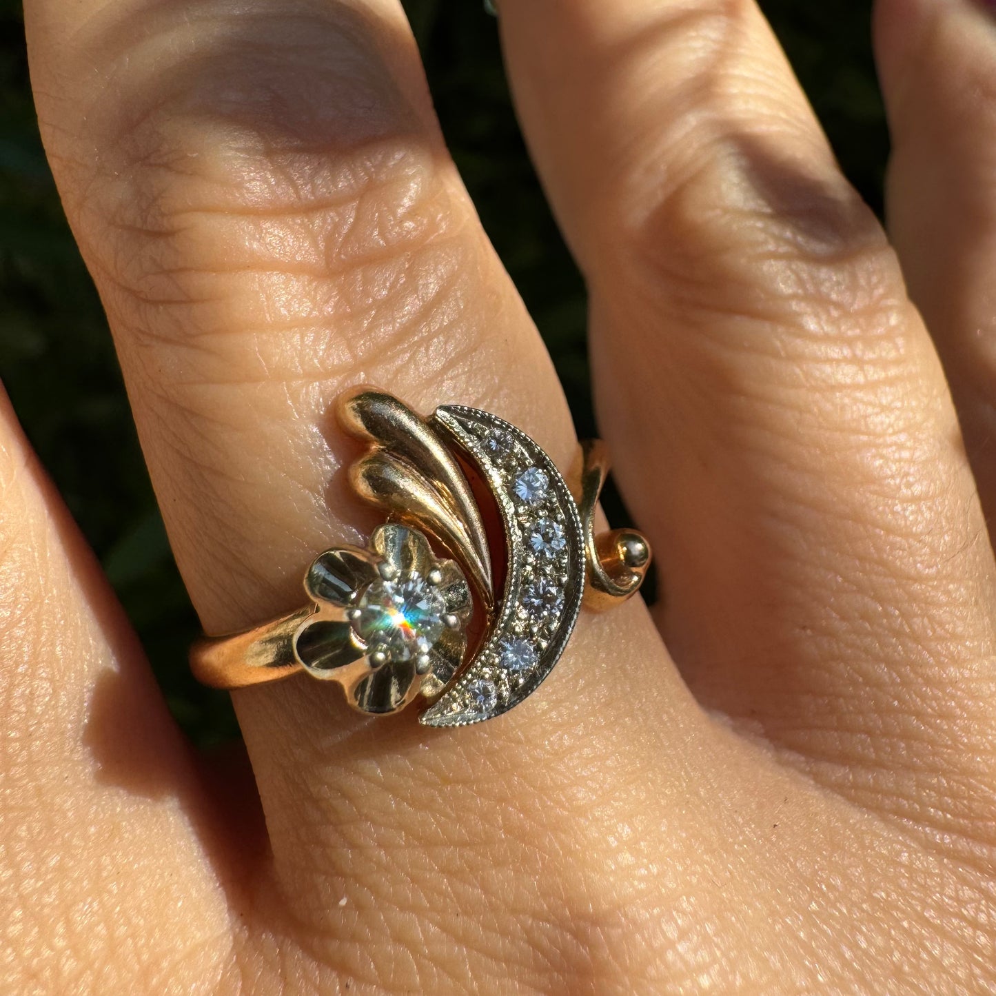 14K gold ring with a delicate moon and star motif set with Diamonds