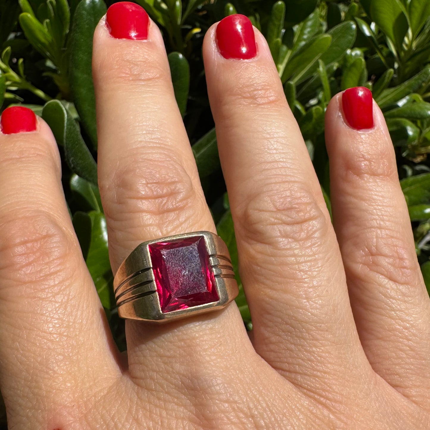 10K gold ring set with a bold red rectangular gemstone