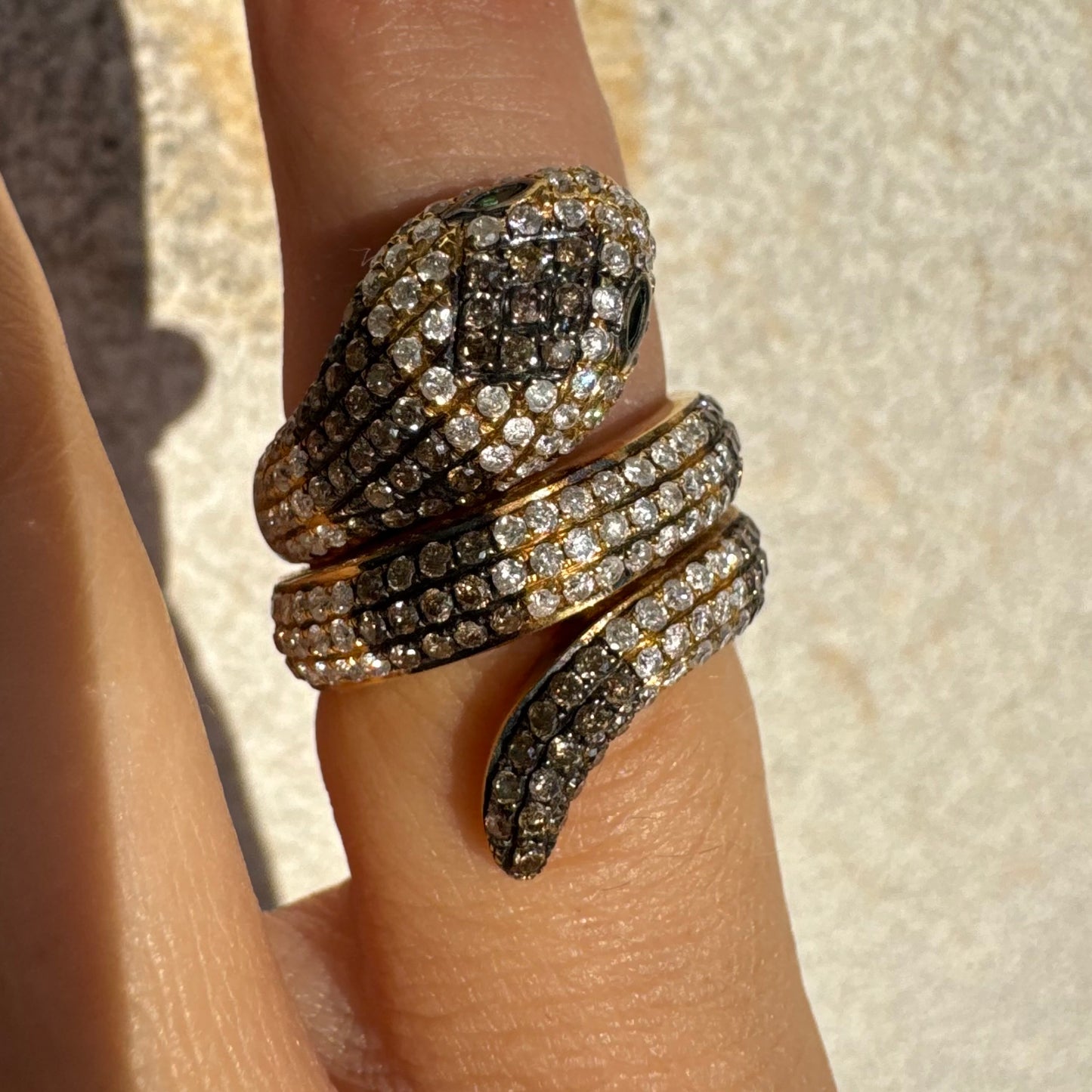 14K gold snake ring fully set with white and black Diamonds, creating a striking contrast and luxurious sparkle.