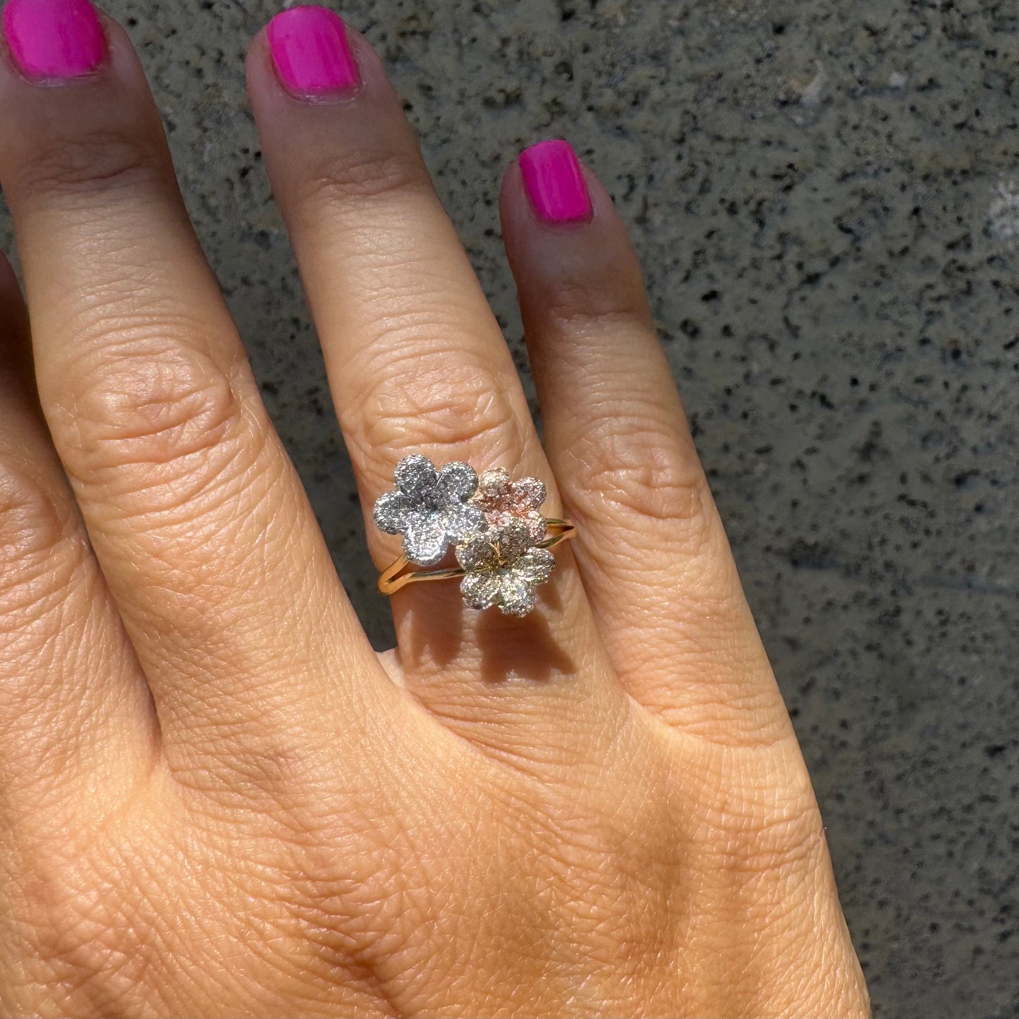 14K gold trio ring featuring white, yellow & rose gold blossoms, each encrusted with sparkling Diamonds.