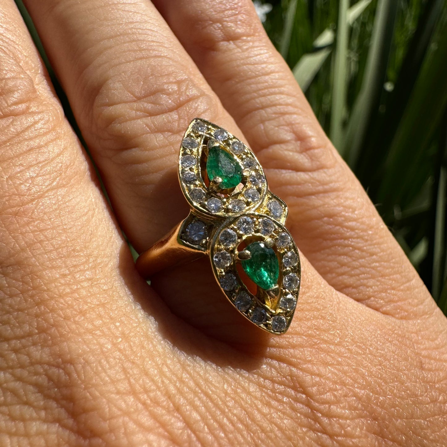 18K gold ring set with two pear-cut Emeralds & Diamonds