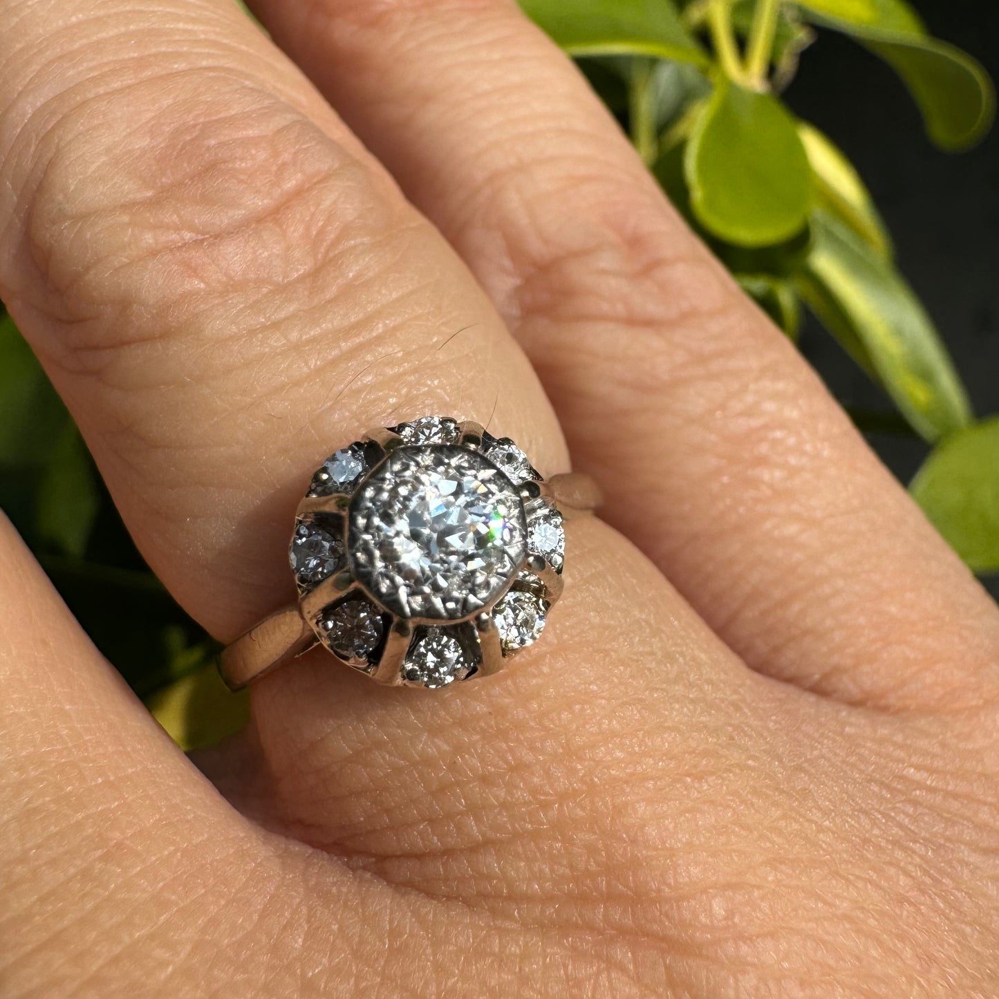 18K gold ring set with Diamonds in     a classic cluster-style