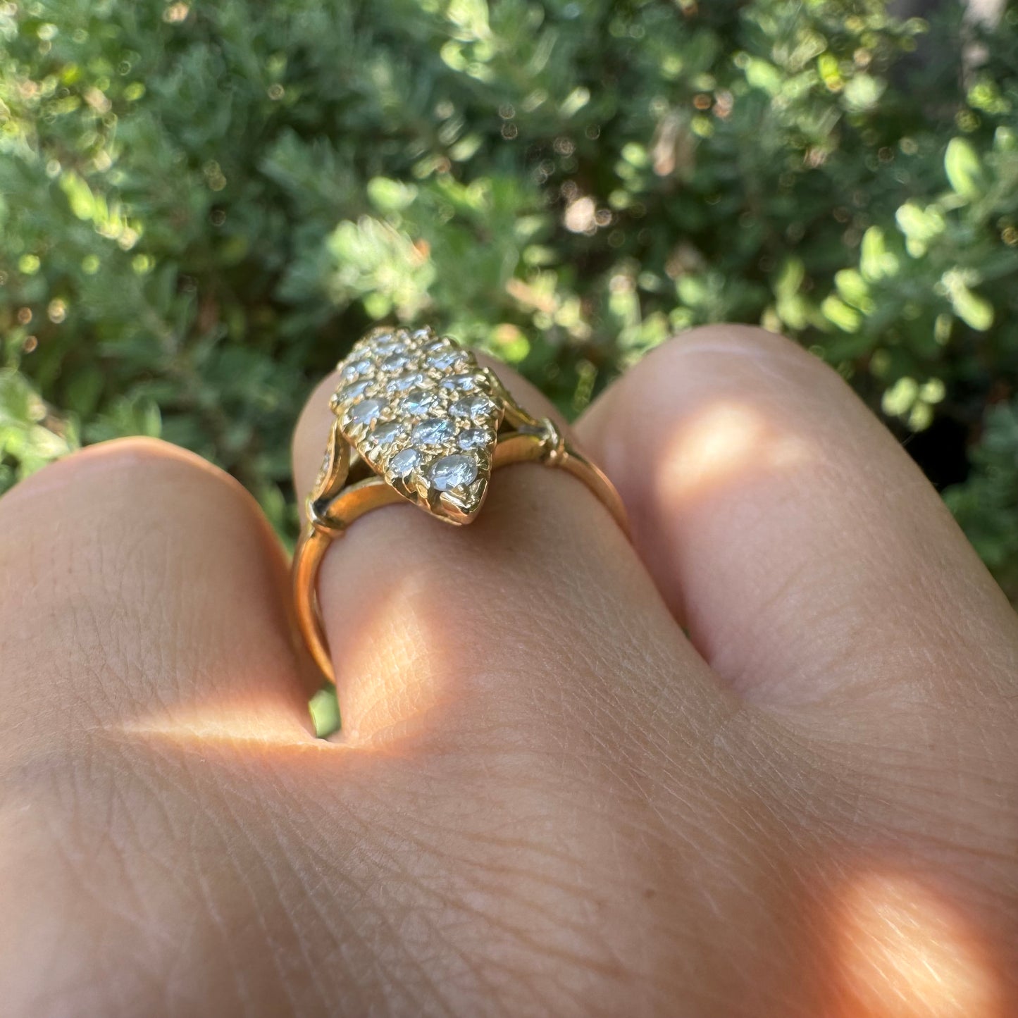 18K gold marquise-shaped ring set with multiple rows of sparkling Diamonds