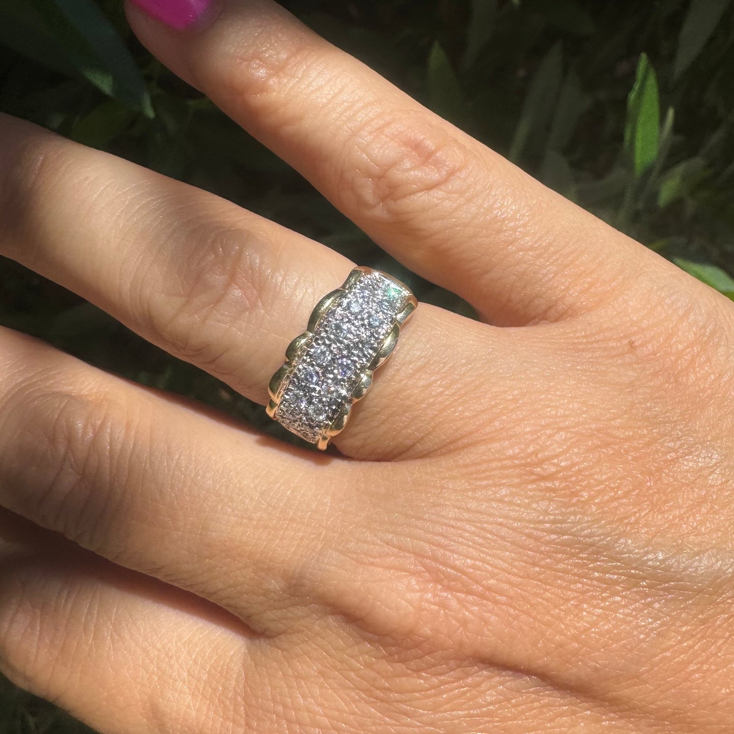 14K gold ring set with center pavé of sparkling Diamonds framed with softly waved gold edges