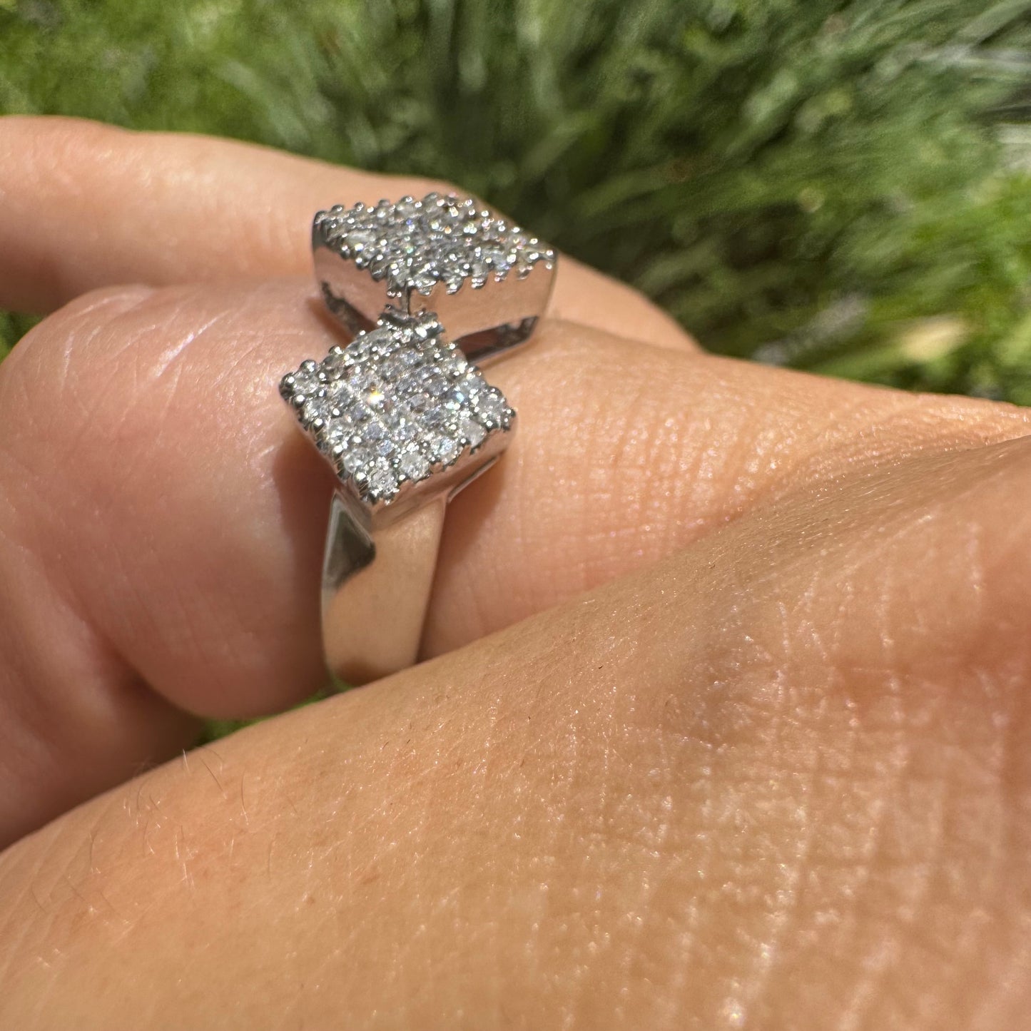 14K gold ring with three square clusters of sparkling Diamonds