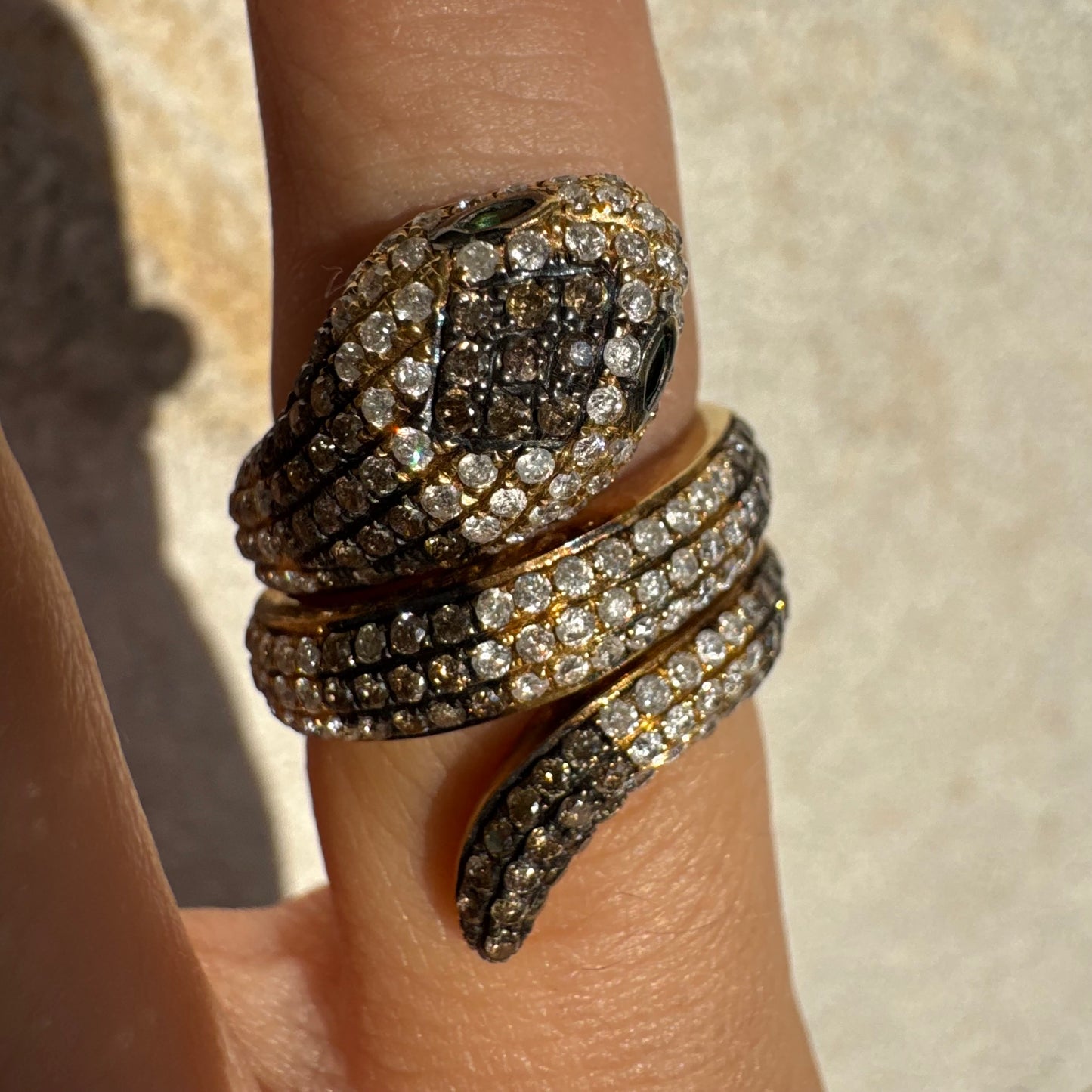 14K gold snake ring fully set with white and black Diamonds, creating a striking contrast and luxurious sparkle.