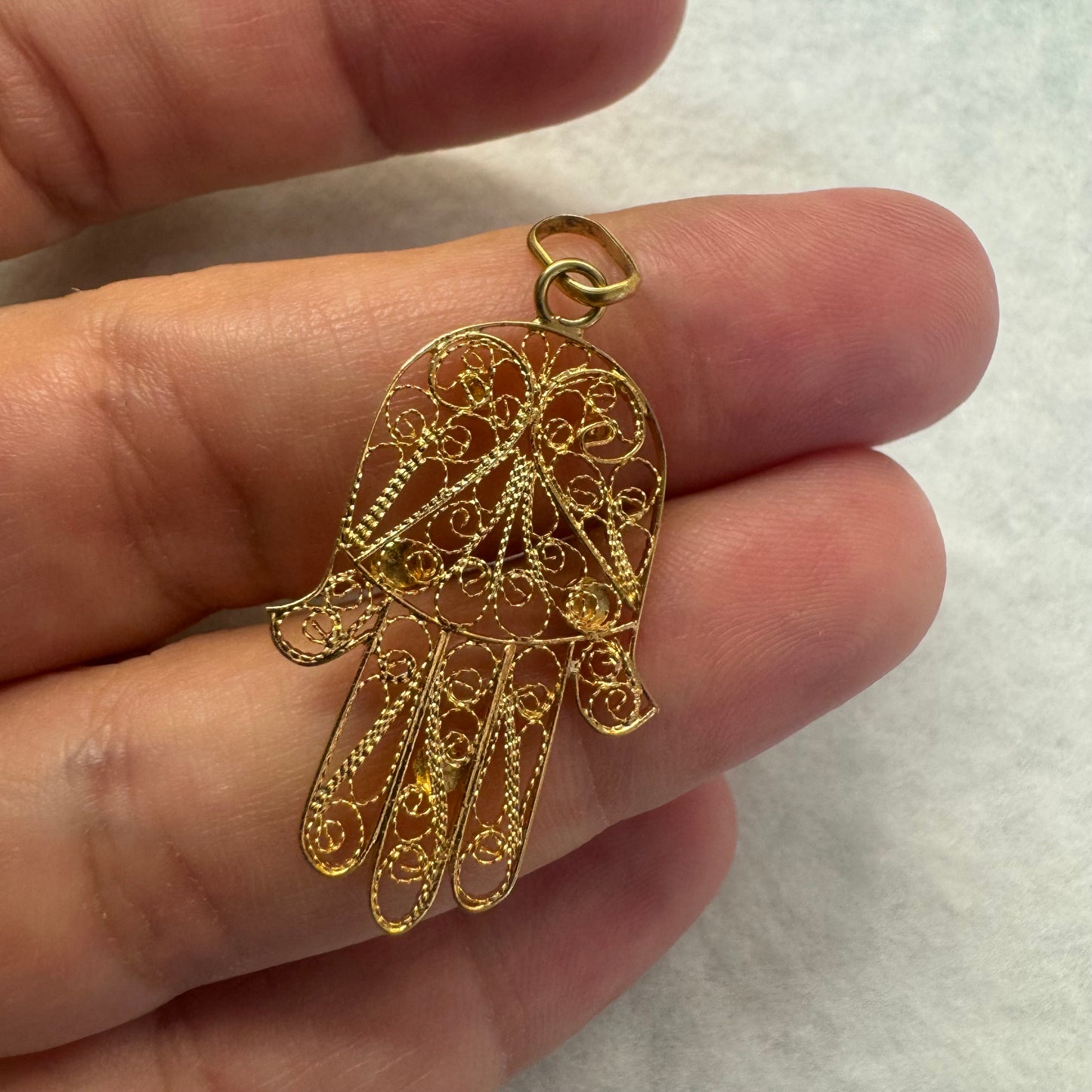 18K gold “Hamsa” pendant