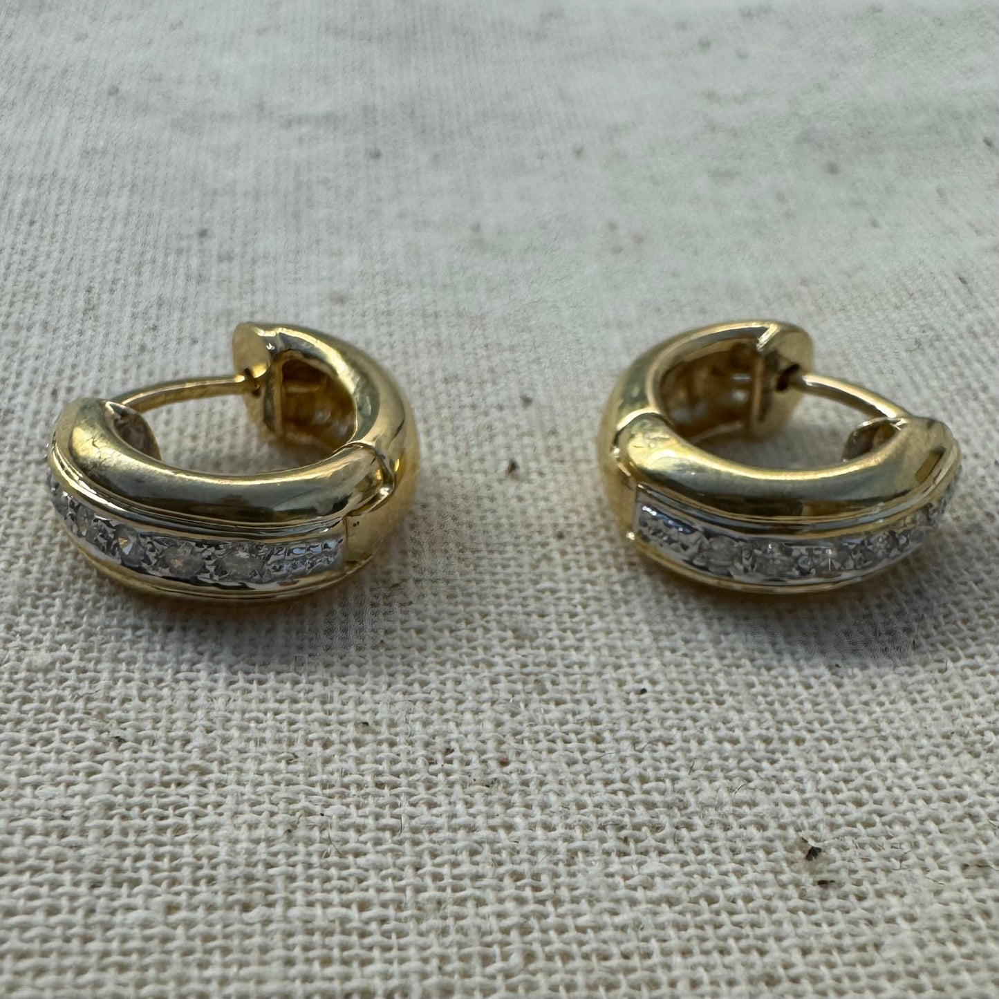 14K gold hoop earrings set with a row of sparkling Diamonds in a sleek channel setting