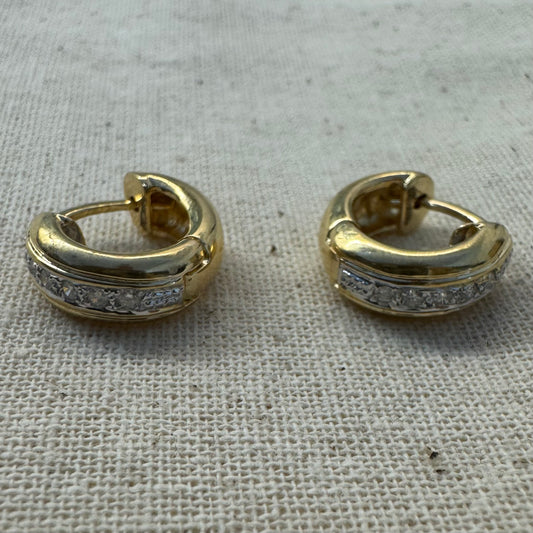 14K gold hoop earrings set with a row of sparkling Diamonds in a sleek channel setting