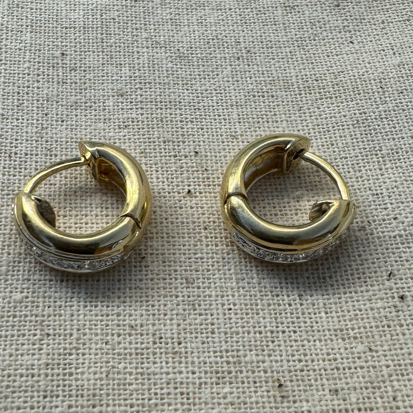 14K gold hoop earrings set with a row of sparkling Diamonds in a sleek channel setting