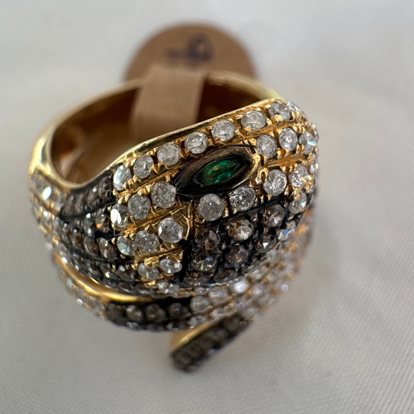 14K gold snake ring fully set with white and black Diamonds, creating a striking contrast and luxurious sparkle.