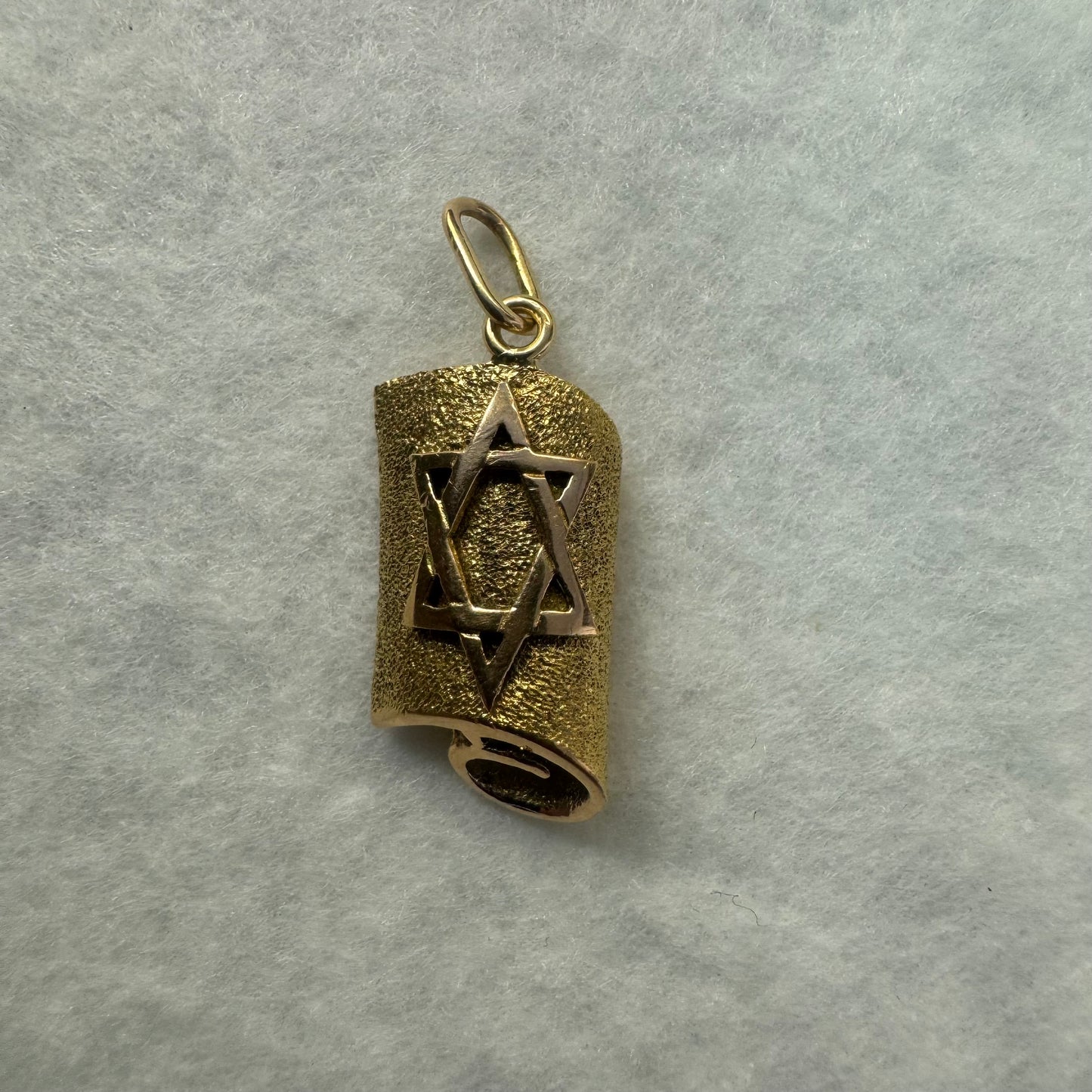 18K gold handcrafted pendant in the shape of a scroll, featuring a raised Star of David.