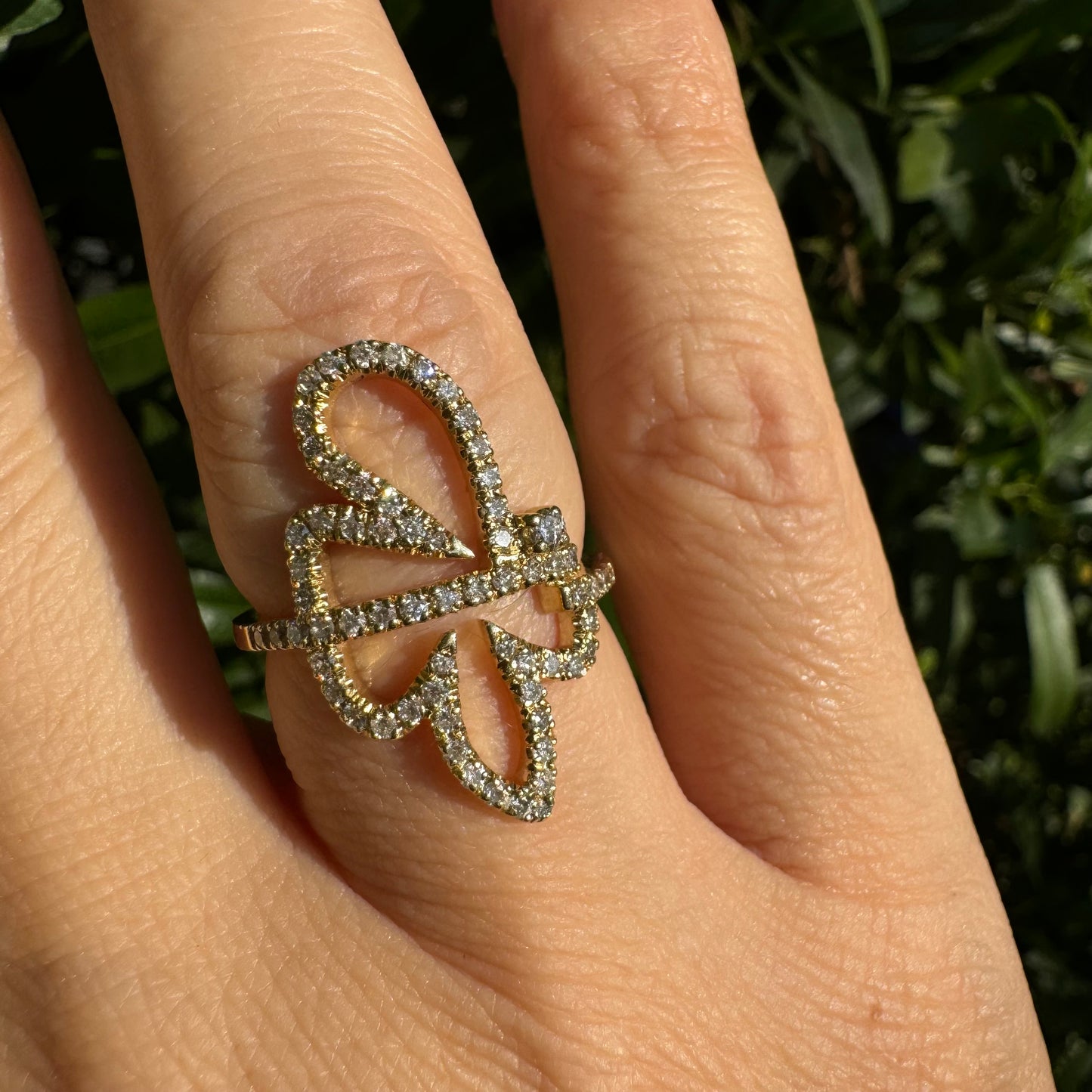 14K gold ring in an open butterfly design, outlined with sparkling Diamonds
