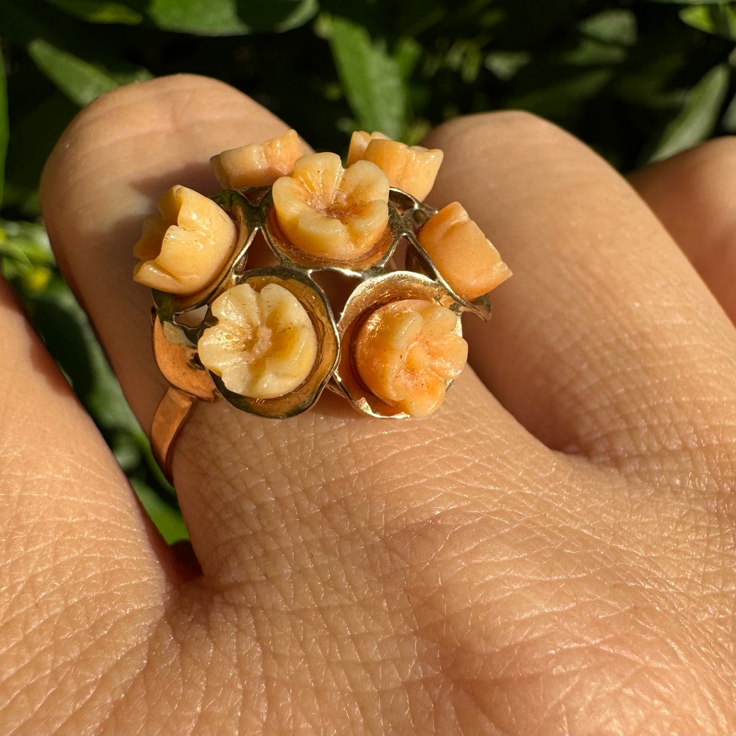 9K gold ring featuring a cluster design with carved Coral flowers in warm orange tones