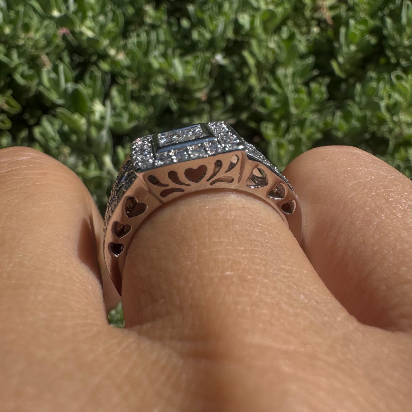 14K gold ring featuring a square cluster of princess-cut Diamonds in the center, surrounded by a double halo of smaller round Diamonds & gold details along the band.