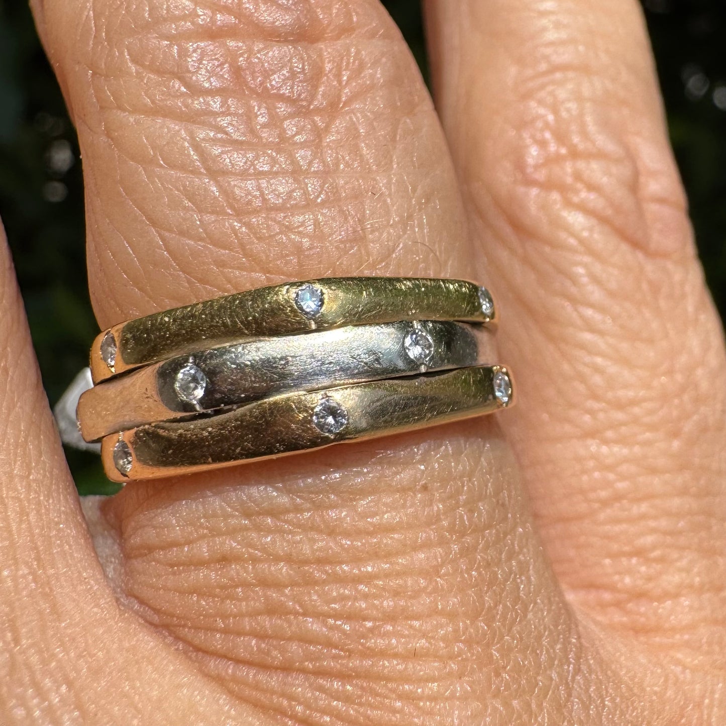 18K gold ring crafted in yellow, white, and rose gold, featuring a triple-band design set with Diamonds