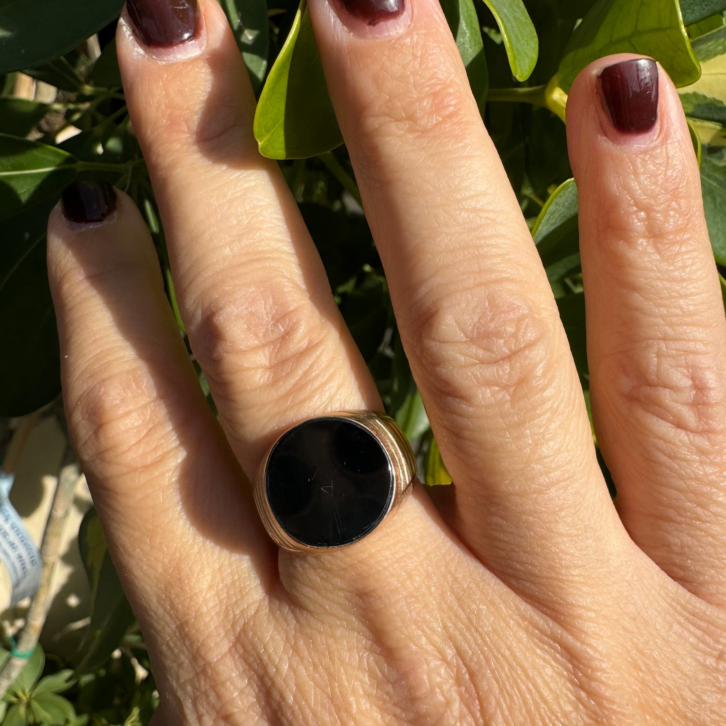 14K gold signet ring crafted in yellow gold, set with a smooth Black Onyx.