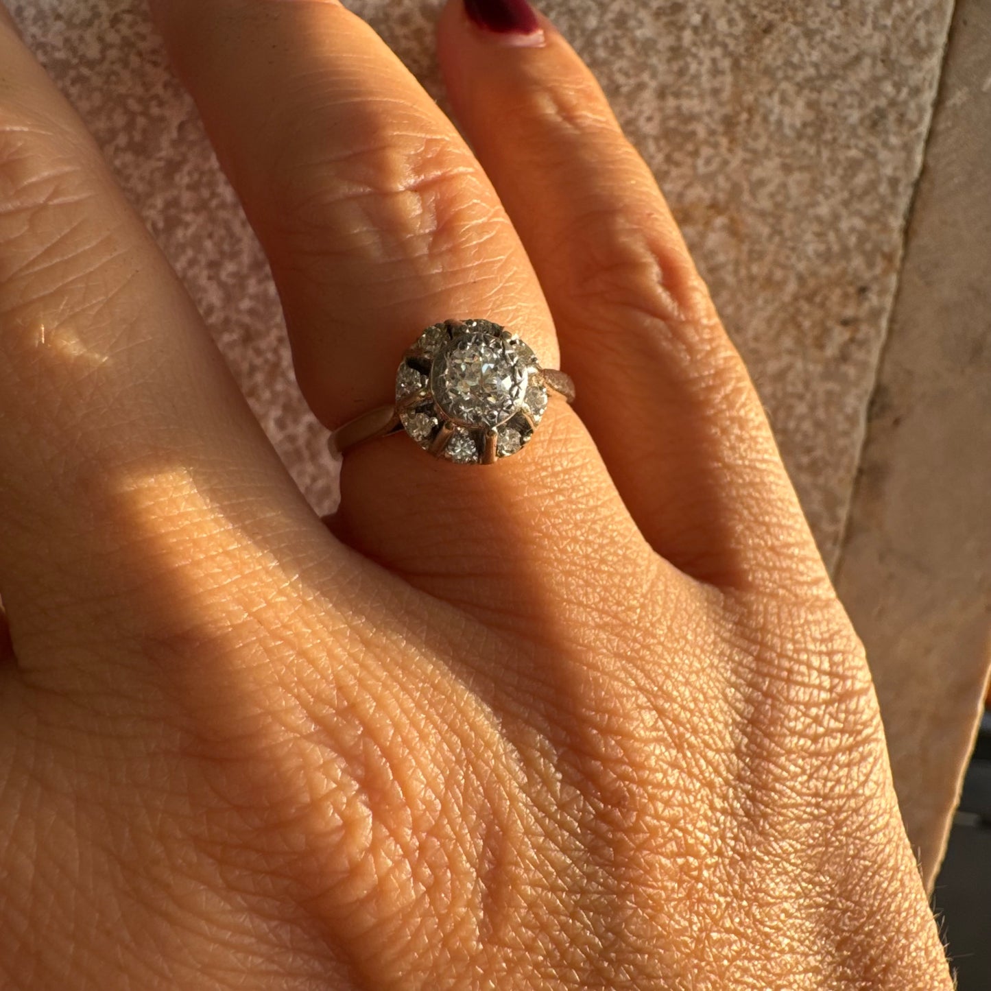 18K gold ring set with Diamonds in     a classic cluster-style