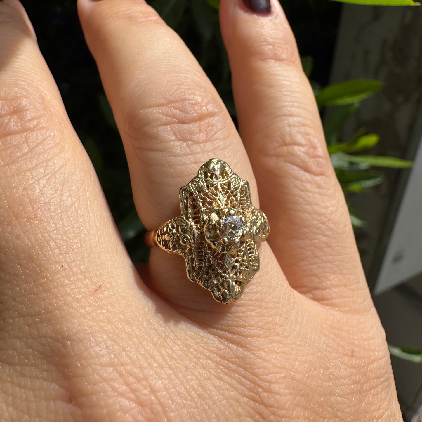 14K gold filigree ring set with an old-cut Diamond