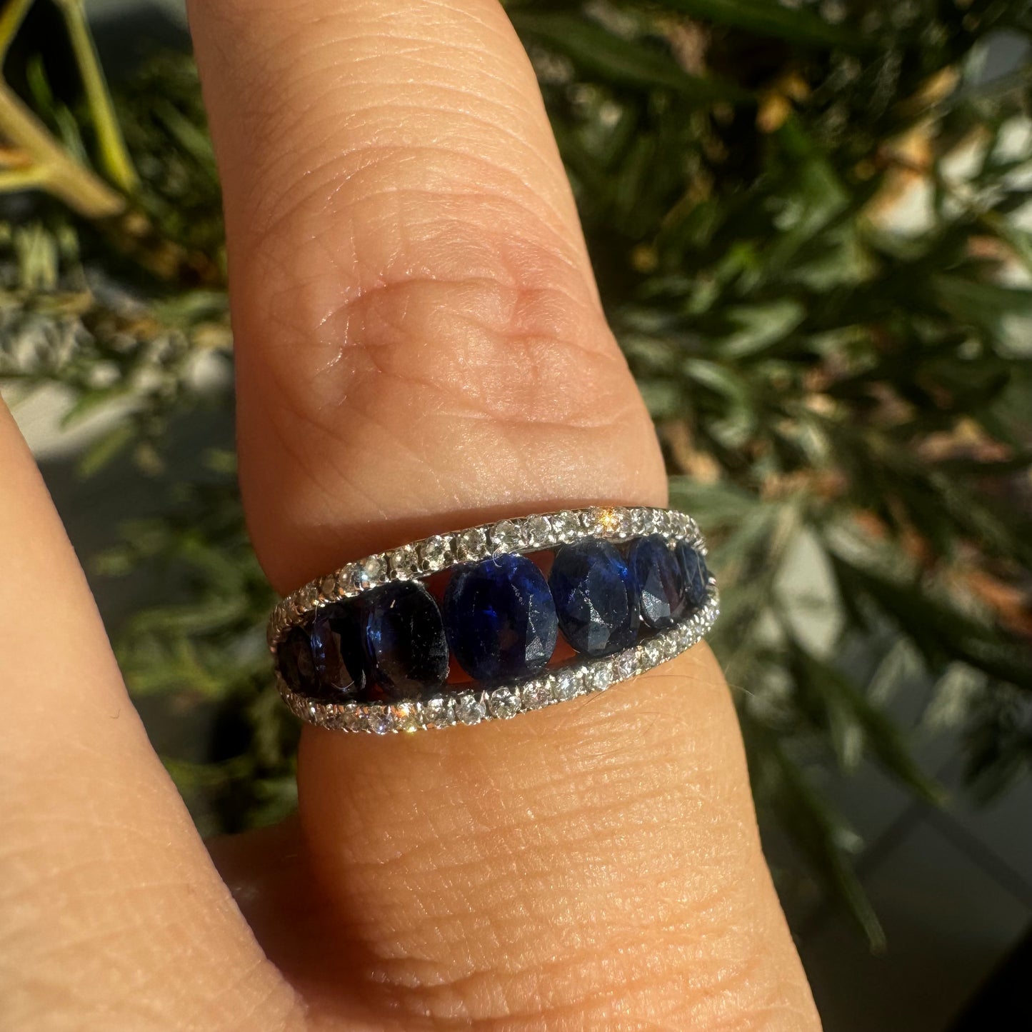 18K gold ring set with a row of deep blue Sapphire & Diamonds
