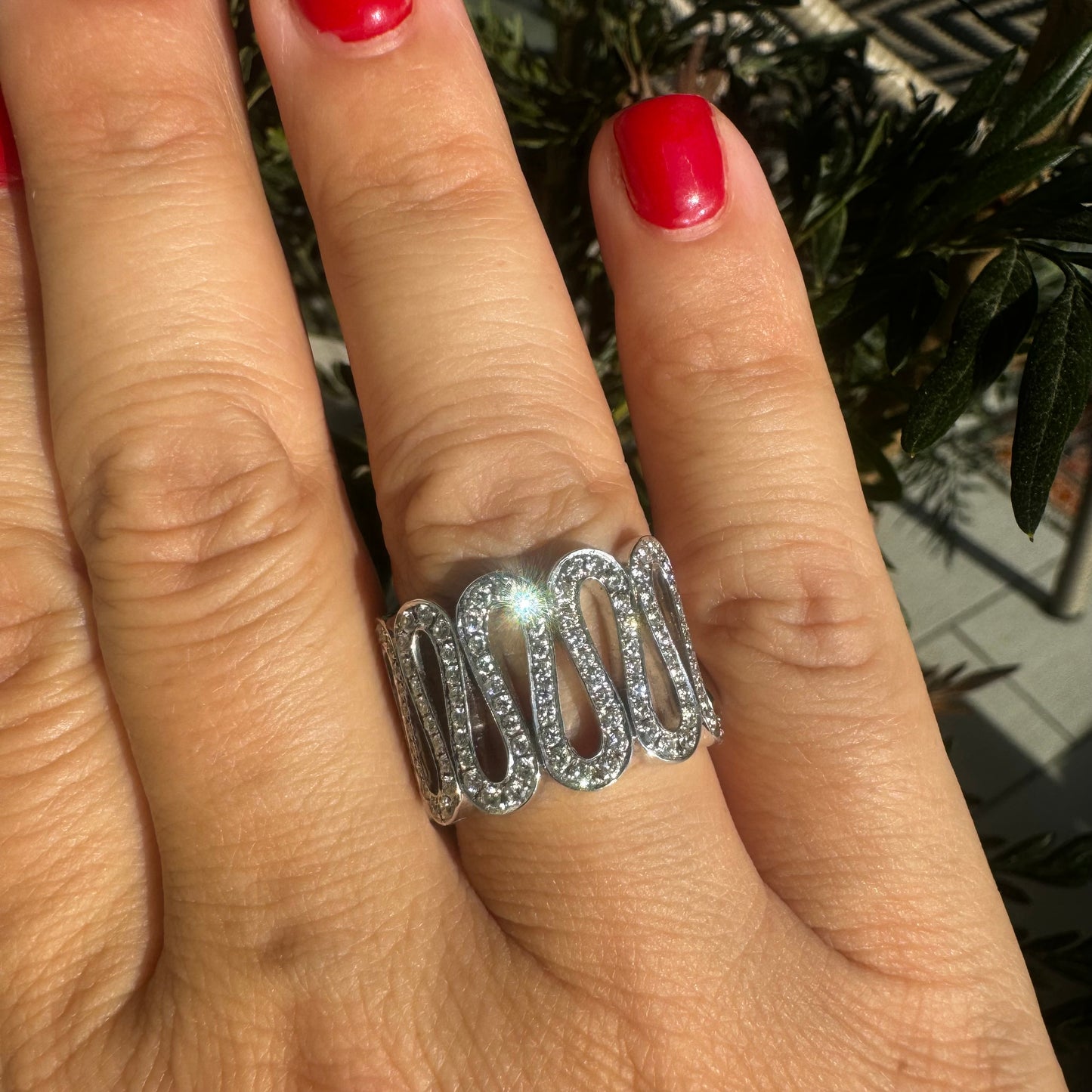 14K gold ring set with shimmering Diamonds in a flowing wave design