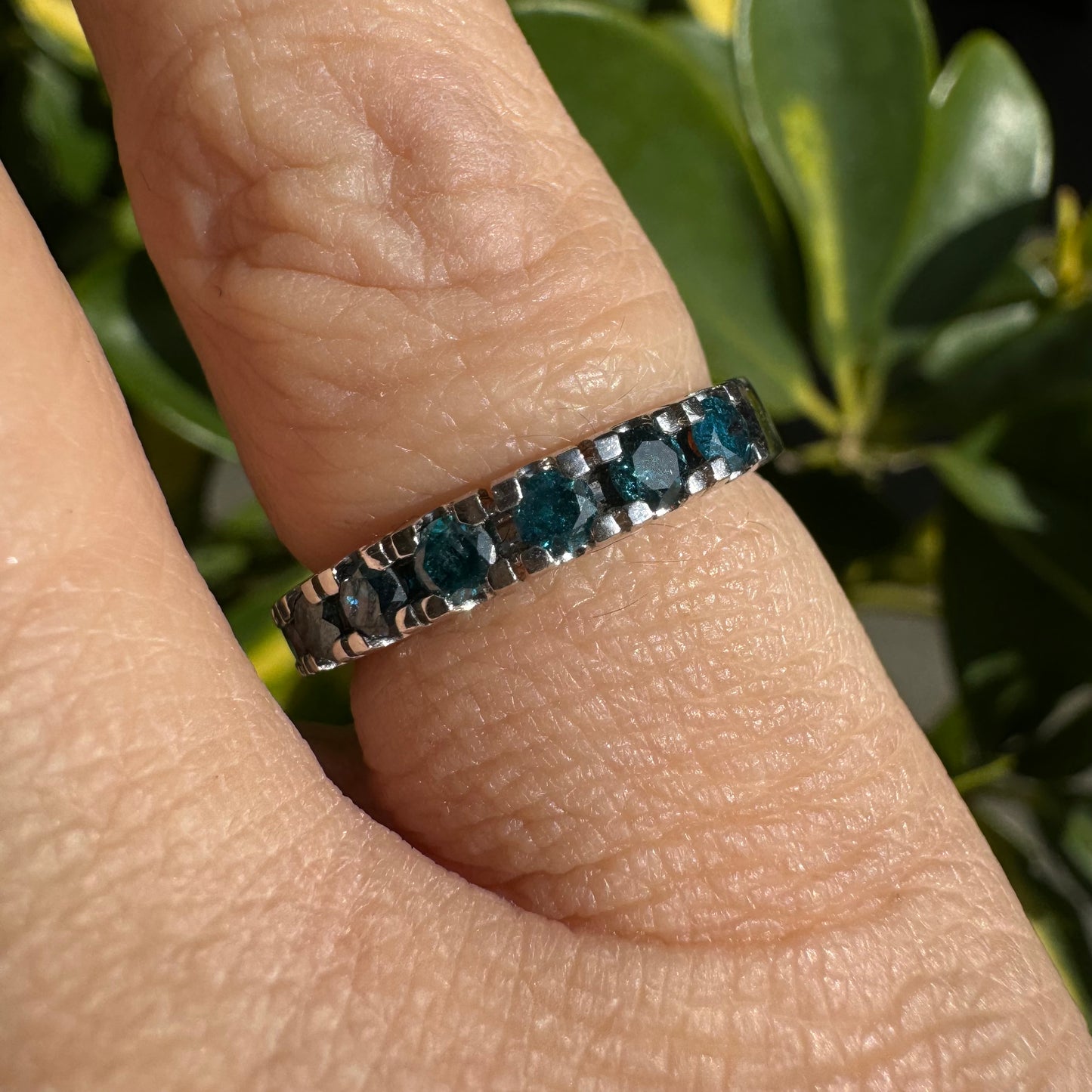 14K gold ring set with blue Diamonds