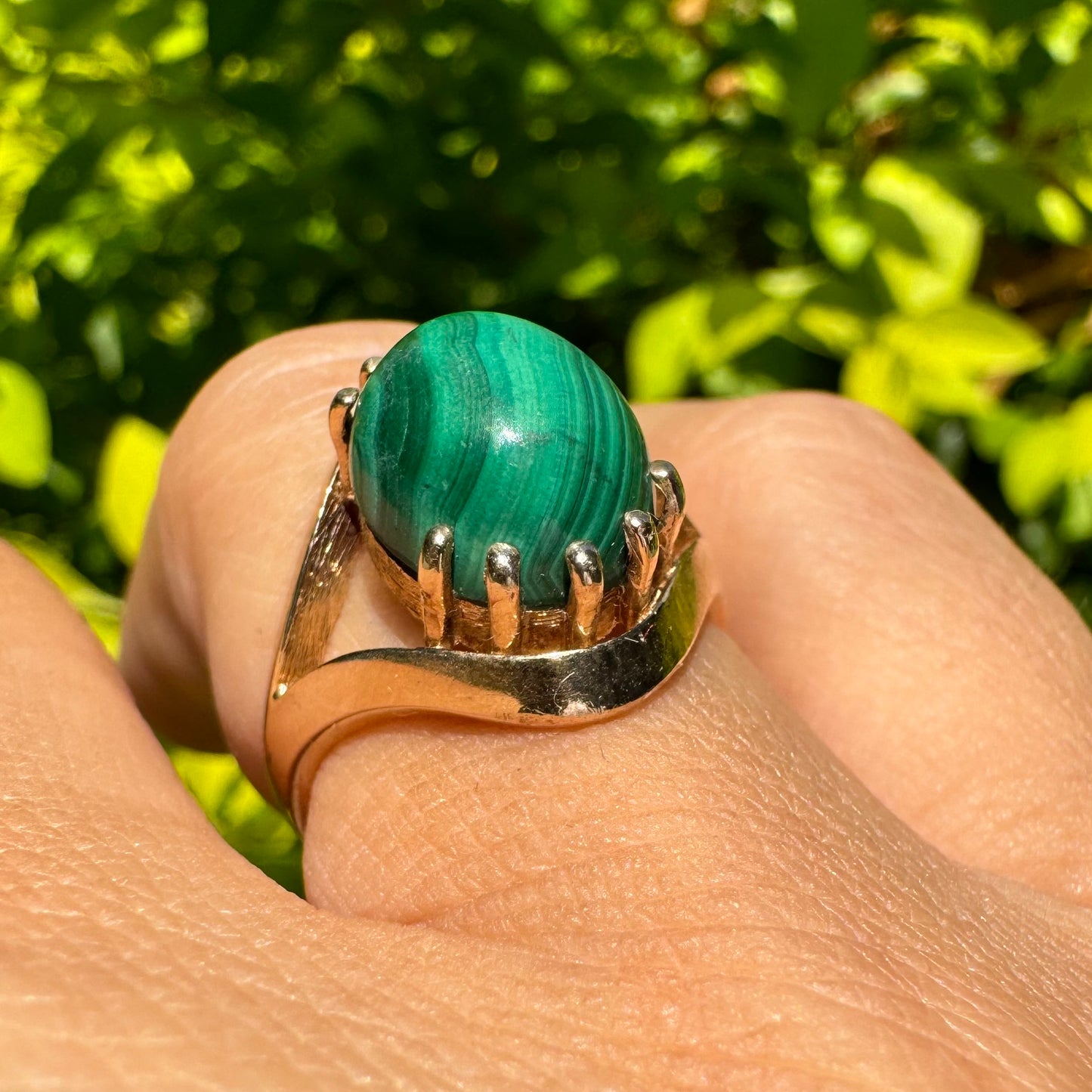 14K gold ring set with a polished Malachite cabochon
