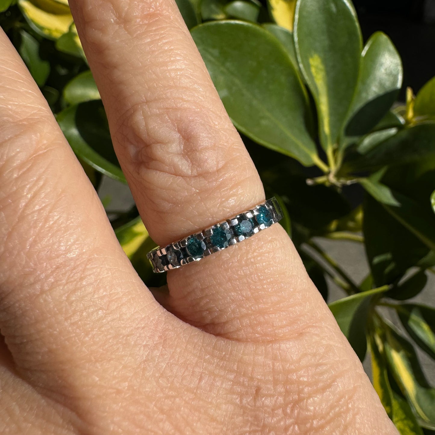 14K gold ring set with blue Diamonds