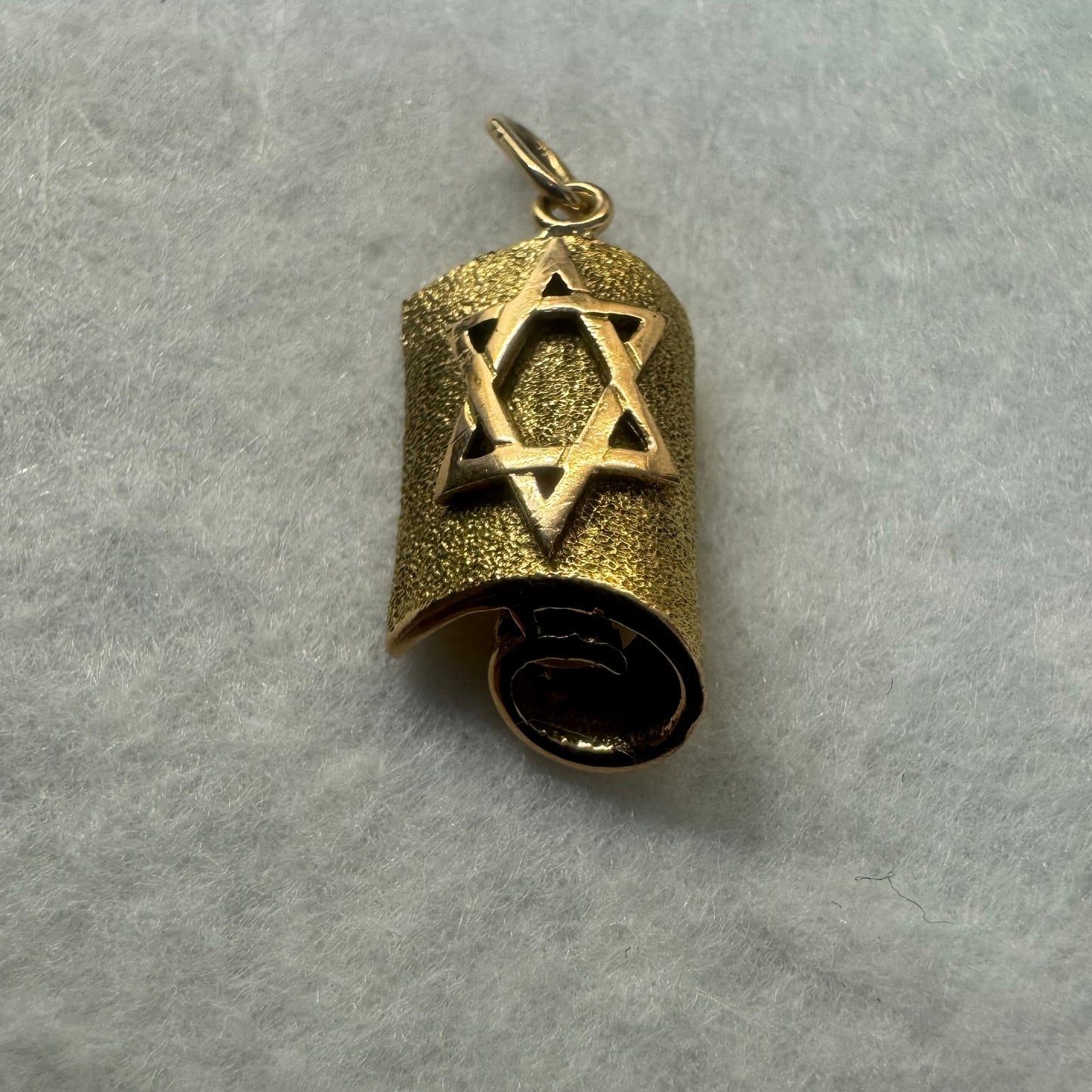 18K gold handcrafted pendant in the shape of a scroll, featuring a raised Star of David.