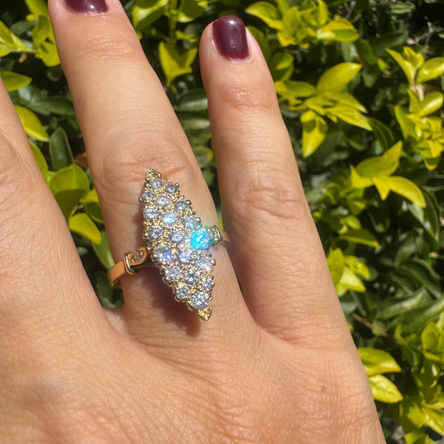 18K gold marquise-shaped ring set with multiple rows of sparkling Diamonds