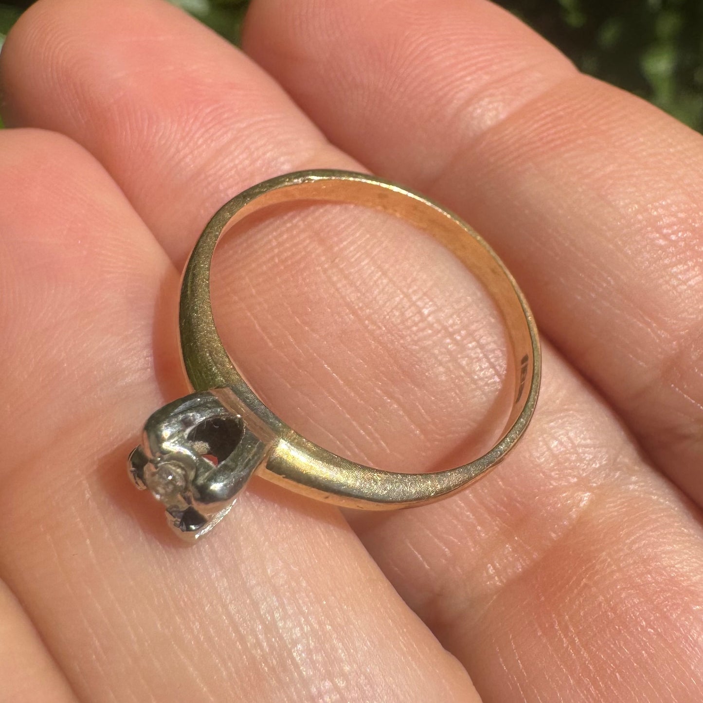 14K gold solitaire ring set with a small round Diamond