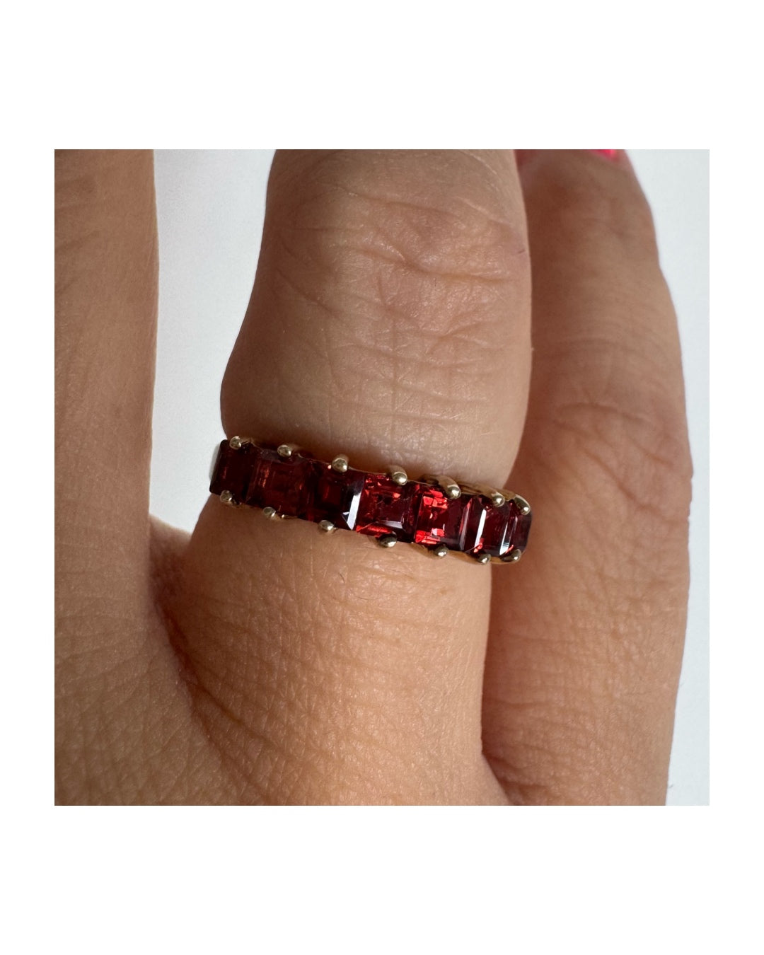 9K gold ring set with deep red garnets