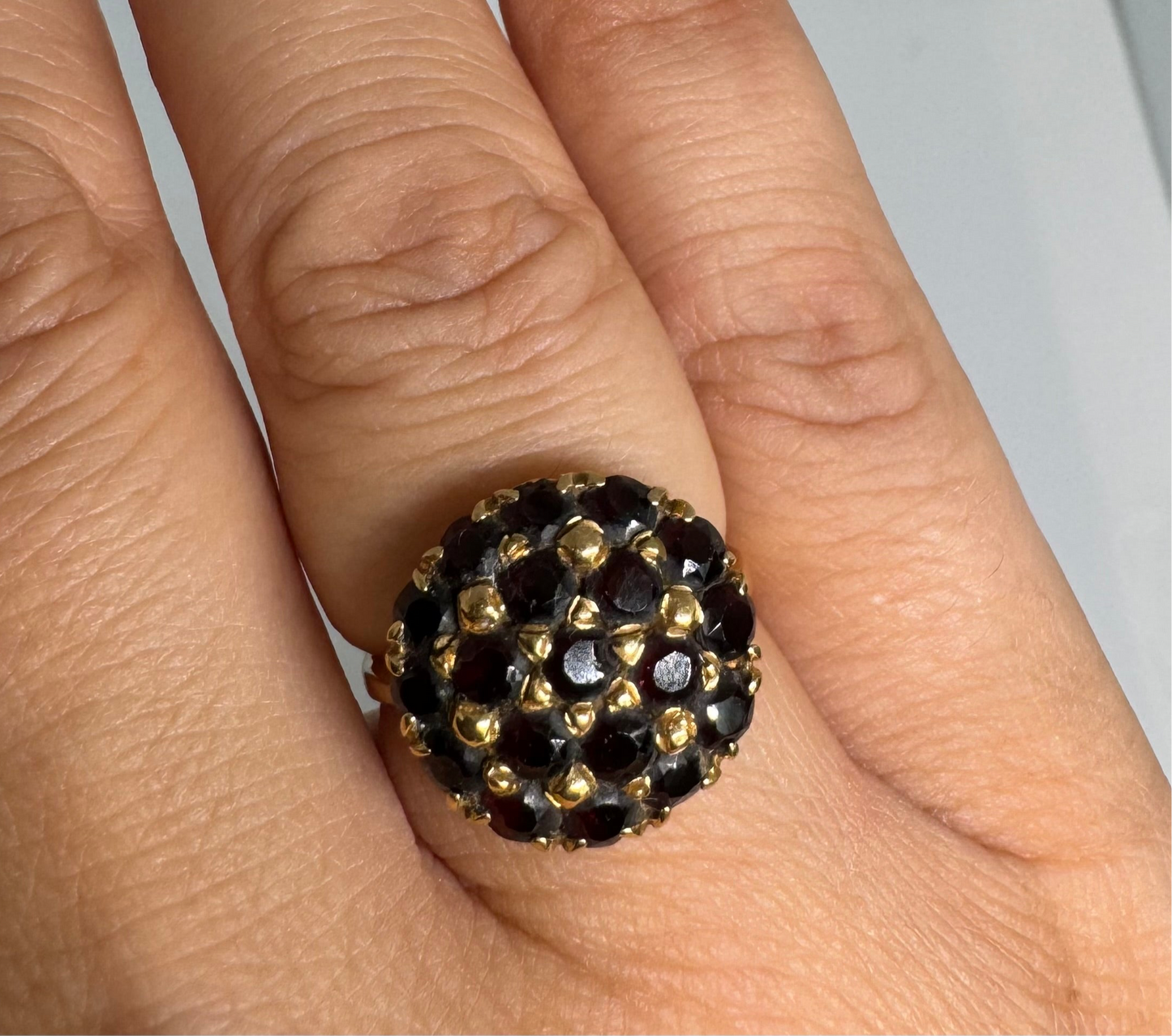 18K gold ring set with Garnets in rich gold prong settings