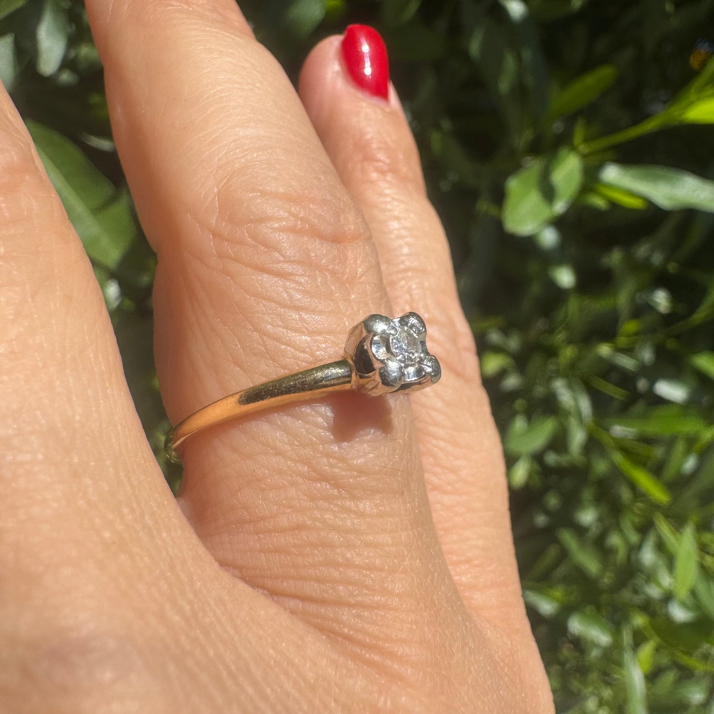 14K gold solitaire ring set with a small round Diamond