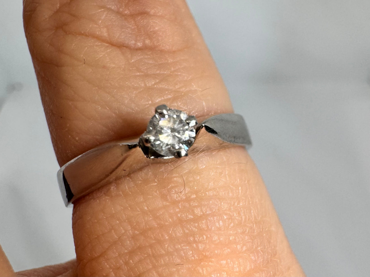 14K gold ring set with one center Diamond